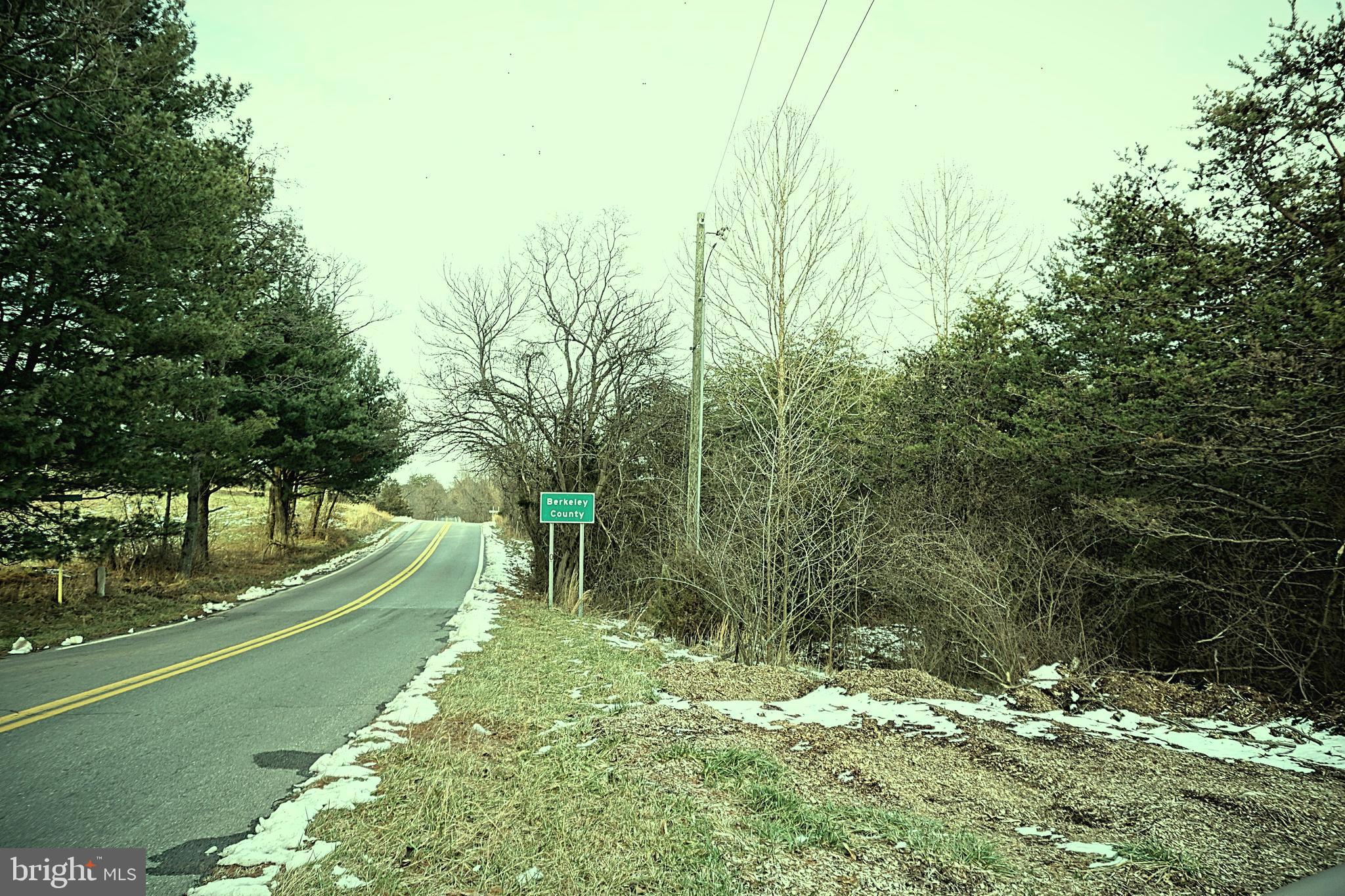 Almost 12 acres of unrestricted, private, level and all usable land. Property runs along VA/WV state line starting by the WV sign on 45 , road frontage goes all the way close to the old barn , that side border is mostly fenced.
Great location, easy access to Winchester and Martinsburg amenities. Lot has long frontage on Rt 45 (Apple Harvest Dr,) . It was being used for horses before.
Many possibilities; Including starting your own farm, have your horses, chickens and goats , or building your dream home in this all usable 12 acres. Only 86 miles to DC, 73 miles to Tysons, 16 miles to Winchester , 23 miles to Charles Town WV