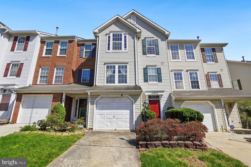Welcome to 18843 Harmony Woods Lane, a spacious townhome nestled in the heart of Germantown. Offering over 2,000 square feet of finished living space across three levels, this home perfectly blends comfort, functionality, and convenience.

Step inside through the lower-level entry, where a welcoming foyer with a two-story ceiling. This level features a cozy family room with a wood-burning fireplace, direct access to the attached garage, and walkout access to a fully fenced backyard ideal for relaxing or entertaining. A dedicated laundry area completes this level.

Upstairs, the main level showcases a living room filled with natural light from a large window and features durable LVP flooring. The spacious eat-in kitchen offers abundant cabinet storage, a center island with breakfast bar seating, and a dining area that opens to a private deck overlooking a peaceful, tree-lined backdrop.

The upper level features three well-appointed bedrooms and two full bathrooms. The primary suite boasts a generous walk-in closet with custom shelving and a private ensuite bath. Two additional bedrooms share a full hallway bath, providing comfortable accommodations for family or guests.

Ideally located just minutes from major commuter routes and local transit options including the MARC Train less than a mile away, this home offers exceptional accessibility. Residents also enjoy community amenities such as walking paths and playgrounds, along with close proximity to shopping, dining, parks, and schools.

Don’t miss the opportunity to make this inviting Germantown townhome your next home! Schedule a showing today!