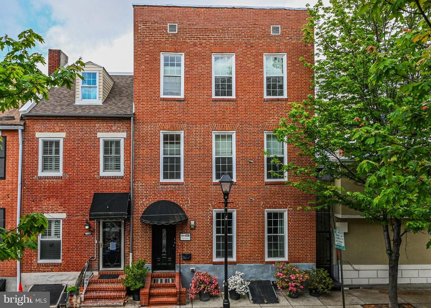 Introducing BlancNoir, an extraordinary gem in the heart of Baltimore’s vibrant Little Italy—one of only a select few licensed bed & breakfasts in the city. This stunning property offers a rare blend of modern luxury, investment potential, and a coveted location just moments away from some of Baltimore’s most renowned neighborhoods and attractions. BlancNoir boasts four beautifully designed guest rooms, each with its own unique style, from oversized spa tubs to state-of-the-art smart-home features. These rooms offer the ultimate in comfort and privacy, making it the perfect setting for guests or a private retreat. The main level of the home features open-concept living areas, a cozy gas fireplace, and large windows that flood the space with natural light. Multiple lounge areas, both inside and outside, including a spacious deck and patio, offer the perfect environment for relaxation and entertaining. A rare and highly desirable feature in the city, this spacious, secure four-car garage provides ample parking or can be repurposed for other uses. Whether you need space for vehicles, storage, or even as an expanded area for your business, this garage is truly one-of-a-kind in this area. The property is zoned C-1, which allows for a wide range of commercial and residential uses, giving you endless possibilities for future endeavors. Whether you choose to continue the B&B business, convert the space into a private residence, or explore other commercial uses, the flexibility of this zoning makes BlancNoir a rare and highly valuable investment. BlancNoir is ideally located to take full advantage of Baltimore’s rich culture and thriving arts scene. You’re just a short stroll from the famous Inner Harbor, vibrant Fell’s Point, and the trendy restaurants and shops of Harbor East. With Camden Yards and M&T Bank Stadium close by, plus countless dining, entertainment, and cultural venues in the immediate area, this location is perfect for those wo want to enjoy everything Baltimore has to offer.