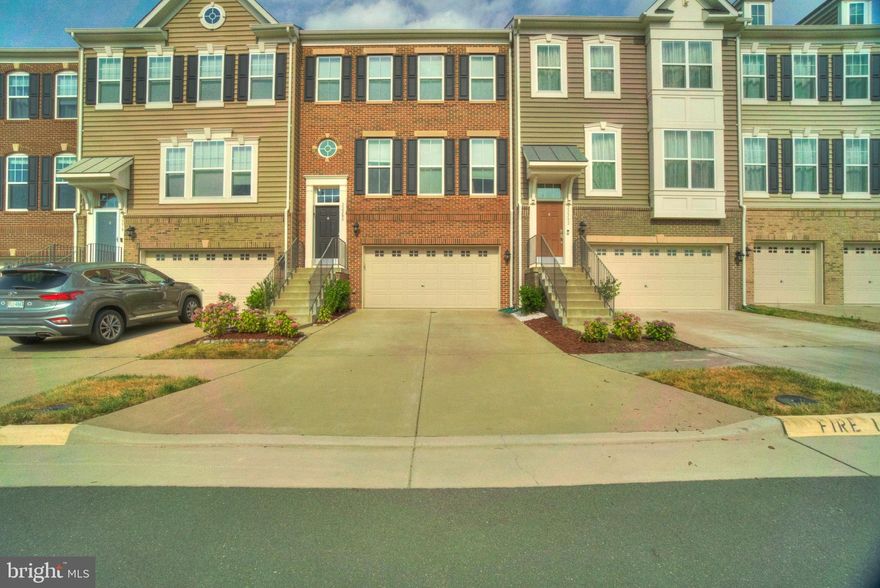 This townhome is equipped with a beautiful kitchen that is the focal point of the home. It has a spacious island and plenty of room for cooking, working, and socializing, making it a versatile space. The industrial pendants complement the stainless steel appliances perfectly. On the upper level, the large primary suite features a spa-like bathroom, along with two secondary bedrooms and a full bath. There's also a convenient laundry closet. The lower level includes a full bath, a rec room with carpet, and a sliding glass door leading to the backyard. Additionally, the community boasts a large common area and a walking path. There is ample parking, common areas, and a play area for children. Belmont Run is conveniently located at the corner of Croson Rd. & Belmont Ridge Rd, providing easy access to the toll road, shopping, and metro.