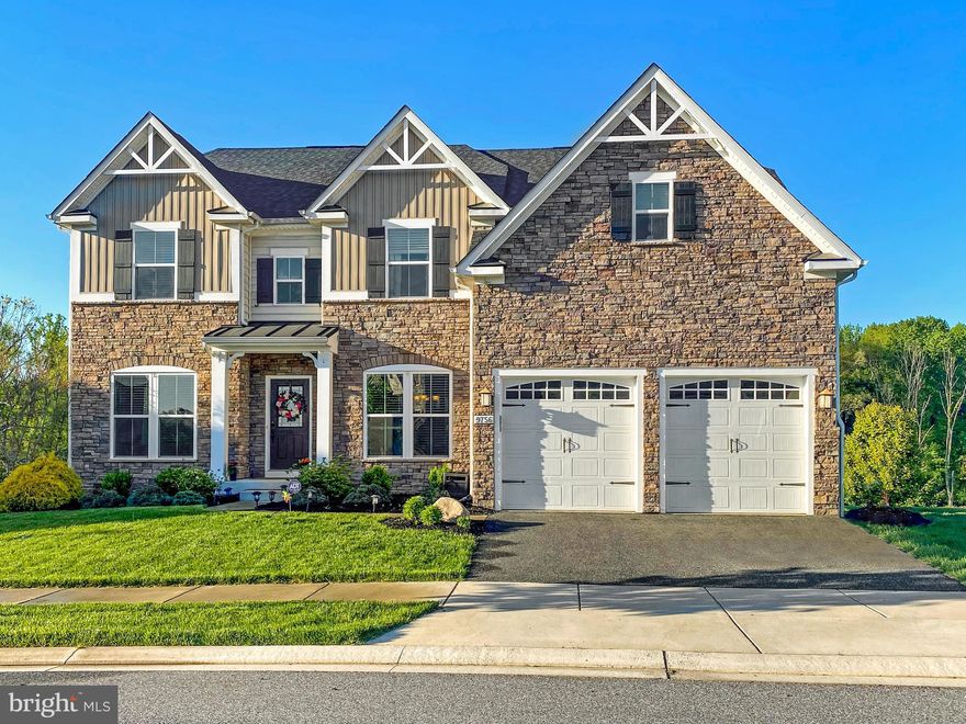 Stunning Ryan Homes (Oberlin Terrace model) colonial in most sought-after Gunpowder Overlook Community! This is a premier location that sits at the highest elevation in the northernmost section of Perry Hall! Park-like setting with community open space, excellent house placement and easy access to all that Perry Hall has to offer including walking distance to Angel Park, Perry Hall Library and local convenience stores. This home sits on one of the best lots in the community - flat lot backing to acres of open area. Stylish carriage themed exterior with covered front entrance, full stone front, board and batten siding and premium beaded vinyl siding on the sides and rear of the home. Flooded with natural light throughout the house and upgrades abound with two-level crown modeling on the first and second floors, 5” hand scraped hardwood on the first floor, premium granite countertops and upgraded 36” cabinets in the kitchen, fully cased windows, 9ft ceilings on the first floor and much more! The Main level has open entry foyer with formal living and dining rooms to the left and right and waterfall stairs straight ahead. First floor office to the left and nearby spacious half bath which can be converted to a full bath in the future. The centrally located large 17’ X 19’ great room with gas fireplace and pre-wired ceiling speakers. Gourmet kitchen with large island, breakfast bar connecting the great room, gas cooktop, dual wall ovens, and two pantries. Adjoining morning room with a door to a 3/4 length rear deck. Enjoy phenomenal nature watching where you will regularly see herds of deer, foxes, groundhogs and the occasional American Bald Eagle. The deck is composed of Timbertech composite boards (fully sealed) and premium Fiberon vinyl rails with winding stairs to grade. The second floor features a stylish primary bedroom suite with sitting area and lighted tray ceiling complete with private entry way, pre-wired ceiling speakers. Huge en suite spa-like bathroom, also with tray ceiling, wall mounted TV, with soaking tub, separate shower, double vanity that leads to a bonus finished closet. Three additional bedrooms, 2 with full walk-in closets with a nearby full bath with dual sinks and marble countertop and conveniently located 2nd floor laundry room accessible in the master entry way. Full unfinished walk-out lower level with rough-in for full bathroom. Home has three zones of HVAC (2 units with a diverter) and a tankless gas hot water heater. Fully finished attached two car garage with sealed floor and wall shelves, complete with service door to a patio.