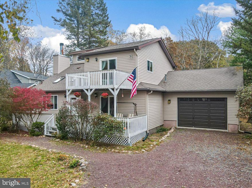 Welcome to your turnkey Pocono retreat in the amenity-filled Towamensing Trails community! Designed for relaxing weekends, entertaining guests, and maximizing short-term rental potential, this spacious and flexible home offers the perfect blend of comfort, fun, and year-round appeal.

Inside, the open-concept living area features soaring ceilings, a cozy wood-burning fireplace, and an inviting layout that brings everyone together. The sunroom steals the show with its built-in bar and game room setup, creating the ultimate space for hosting after a day at the lake, slopes, or trails.

With 3 bedrooms plus a bonus room that easily functions as a 4th sleeping area, along with 2 full bathrooms, there’s plenty of room for guests, large gatherings, or vacation rental flexibility. Brand-new mini split systems in every room provide efficient heating and cooling in every season.

Step outside and enjoy multiple deck spaces designed for entertaining and unwinding, including a brand-new hot tub perfect for cool Pocono evenings under the stars.

The main level features a spacious bedroom with deck access, a full bath, bonus room, laundry area, and garage access for added convenience. Upstairs, the loft overlooking the living space offers a second lounge area, along with another full bath, a large bedroom with private deck access, and a bunk room ideal for maximizing sleeping capacity.

Whether you’re looking for a full-time residence, weekend escape, or income-producing investment property, this home checks all the boxes.

Towamensing Trails amenities include a 190-acre lake with beach access, outdoor pool, clubhouse, restaurant & bar, sports courts, playgrounds, and year-round community events,  all just minutes from skiing, hiking, rafting, and top Pocono attractions.

A true Pocono getaway built for making memories.