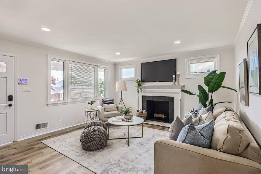 Welcome to this exquisite newly remodeled home situated on an expansive lot in a  desirable neighborhood.  Boasting 5 bedrooms and 3 full bathrooms-two on each level with one in the basement- there is ample space for all.  The heart of this home lies within its newly renovated kitchen, adorned with sleek stainless steel appliances and complemented by black matte fixtures. It opens into a dining area/breakfast room making it a large, inviting space for family and friends to gather. The luxury vinyl flooring throughout the entire home adds a touch of modern sophistication. As you head down to the fully furnished basement,  you'll find an expansive and versatile recreational room along with a full bathroom, bedroom and a laundry room.   Outside you will find an enclosed back porch and a large flat lot- a tranquil retreat where you can relax and enjoy the serenity of your surroundings. This home truly offers convenience and functionality. The long asphalt driveway is capable of accommodating over 4 cars, ensuring ample parking for you and your guests. The quiet neighborhood adds to the peaceful ambiance, providing a serene setting for everyday living.This residence has undergone extensive upgrades, including a brand new HVAC system, ensuring optimal comfort throughout the seasons. The newer windows and roof not only enhance the home's aesthetic appeal but also contribute to energy efficiency. This newly remodeled home presents a rare opportunity to own a stylish and modern residence with generous living space. From the newly renovated kitchen, custom designer bathrooms, to the fully finished basement, every detail has been thoughtfully designed with your comfort and enjoyment in mind. Don't miss the chance to make this exceptional property your own!