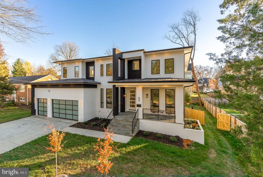 Construction completed!
Every element of this newly built McLean residence reflects thoughtful design, modern luxury, and enduring craftsmanship. Encompassing 7600 square feet, this custom home perfectly balances sophistication and livability in one of Northern Virginia’s most coveted locations.

From the striking façade to the three-car garage and fully fenced backyard, the home makes an immediate impression. Inside, soaring ceilings, 8-foot doors, and sun-filled, open living spaces create an atmosphere of understated grandeur.

The main level is designed for both everyday comfort and elegant entertaining, welcoming you with a formal sitting room and formal dining room that set the stage for refined gatherings before flowing naturally into the heart of the home. This level also features a private office, a full bedroom suite, and a showpiece chef’s kitchen complete with stacked cabinetry, a 48-inch professional refrigerator, a six-burner range, double dishwashers, and a secondary prep kitchen ideal for catering or extended family use. The mudroom offers built-in cubbies and a dedicated pet wash, adding practicality to the refined aesthetic.

The family room spans two levels and centers around a sleek gas fireplace and custom built-ins, framed by oversized windows that bathe the room in natural light.

Upstairs, the primary suite redefines indulgence with dual walk-in closets, a private balcony, and a spa-inspired bath showcasing a steam shower, freestanding soaking tub, and double vanities. Each additional bedroom features its own en-suite bath and generous closet space.

The lower level is crafted for recreation and relaxation, offering a fully equipped wet bar, home theater, fitness room, and expansive recreation area anchored by another fireplace. A guest suite with private bath ensures comfort for visitors.

Practical amenities blend seamlessly with luxury touches—an elevator shaft for future installation, EV charger, and energy-efficient systems throughout.

Located moments from Tysons Corner, downtown McLean, and major commuter routes, this home offers an unmatched combination of serenity and connectivity. Nestled within one of McLean’s most sought-after enclaves, Southridge enjoys a rare balance of privacy and proximity. Within minutes, residents can access world-class shopping and dining at Tysons Galleria and Tysons Corner Center, charming local boutiques and cafés in downtown McLean, and scenic parks such as Lewinsville and Clemyjontri. Convenient connections to I-495, the Dulles Toll Road, and the George Washington Parkway make commuting effortless—whether heading into downtown DC, Arlington, or Dulles International Airport.

The neighborhood embodies refined suburban living with a tranquil ambiance rarely found so close to the city. Exceptional in scale, detail, and design, 6935 Southridge Drive represents the pinnacle of modern McLean living.