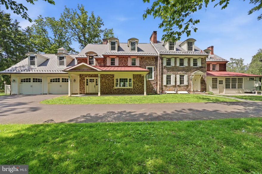 Tucked away on 4+ acres, this exceptional Circa 1799  Bucks County stone farmhouse—with a seamless 6,000+ sq ft addition—beautifully blends old world charm with modern luxury.  Original details include exposed stone walls, wood beams, wide plank floors, deep windowsills, and multiple fireplaces, while the thoughtfully designed addition showcases high-end finishes and craftsmanship throughout. The gourmet kitchen features a vaulted beamed ceiling, three walls of windows, French doors, a center island with farm sink, Viking gas range, Sub-Zero refrigerator, custom cabinetry, honed granite, and radiant-heated bluestone floors. French doors open to an expansive bluestone patio with an outdoor fireplace, pizza oven, gas grill, and a heated saltwater pool perfect for entertaining.  For your convenience there is a shower/changing room within the pool area.  The main level offers a grand dining room with a stone fireplace, a den with original fireplace and porch access, a sunroom, and a mud/laundry hall with built-ins, soapstone sink, and window seat, plus a full bath with a copper tub. The 2015 3,000+ sf addition includes a stunning great room with an  exposed stone wall, gas fireplace, vaulted ceiling, built-ins, and patio access, along with a princess suite, powder room, and custom storage. Upstairs, the luxurious primary suite boasts a sitting room/office with a balcony, spa-like bath, and large walk-in closet. A loft/bonus room, laundry room, two bedrooms, and full bath complete the second level, while the third level offers two additional bedrooms and a hall bath.  Public water and sewer. A rare offering in a prime suburban location near shopping, major roadways, and public transportation—convenient to Philadelphia, Princeton, and NYC.  Pennsbury Schools.  Known as The Thomas Winder house.  Historical information published by the Lower Makefield Historical Society is available.