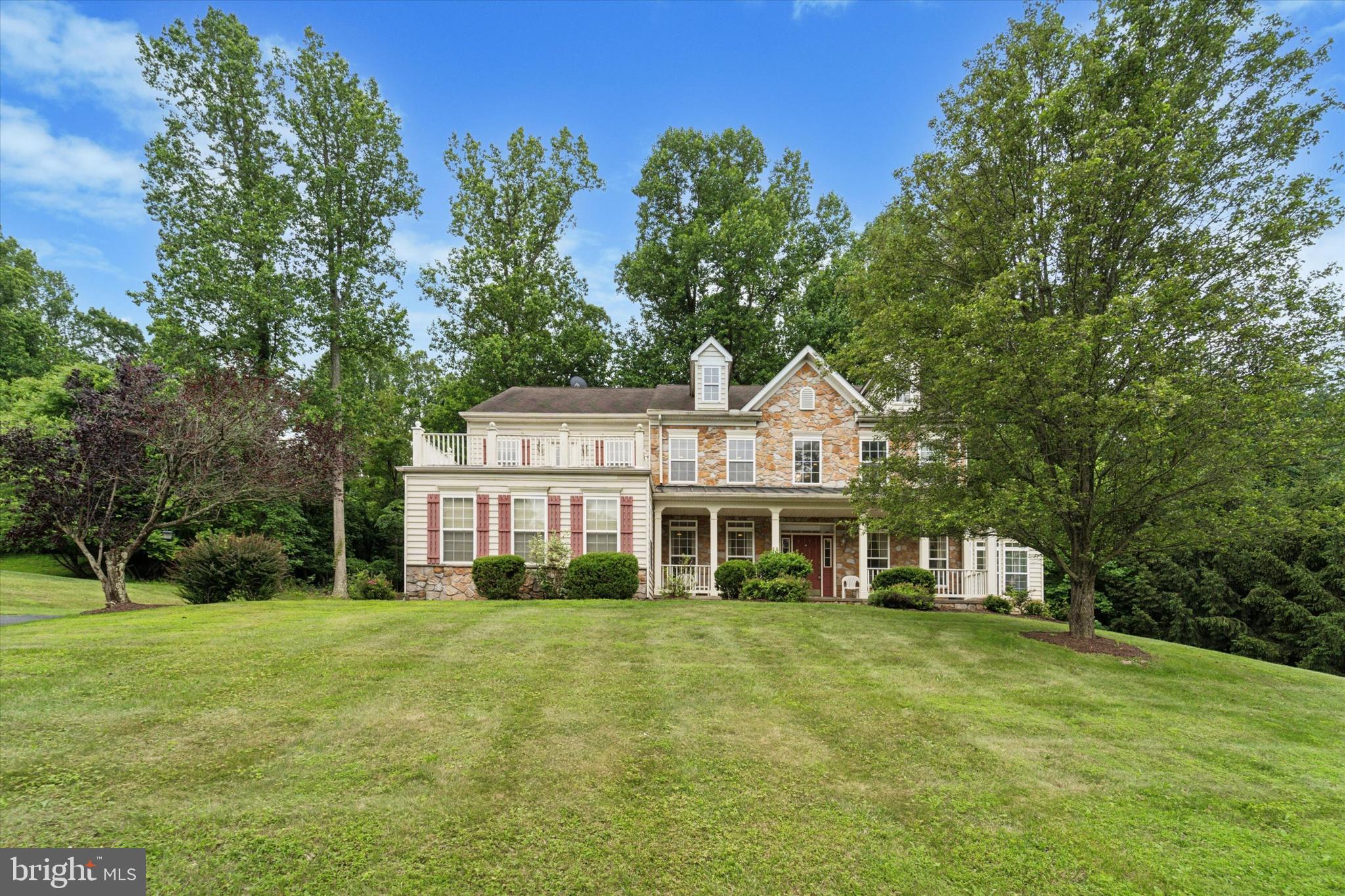 Welcome to 1363 Brookstone Drive, a stately, meticulously maintained residence tucked within one of Delaware County’s most desirable enclaves. Located in the prestigious community of Garnet Valley, this extraordinary five-bedroom, two-and-a-half-bath home offers over 5,000+ square feet of refined living space and an unparalleled combination of comfort, elegance, and functionality. Set gracefully atop a gentle rise, the property exudes presence and sophistication from the moment you arrive. A spacious three-car attached garage provides interior access, while the charming front walkway leads to a welcoming covered porch and formal entrance, a fitting introduction to the grandeur within.Inside, you'll find a thoughtfully designed floor plan that accommodates both relaxed living and sophisticated entertaining. The gracious two-story foyer is flanked by a formal dining room and sitting room, both ideal for hosting guests or enjoying quiet evenings at home. Flooded with natural light, the adjacent sunroom is a warm and airy space perfect for reading, conversation, or morning coffee. The main level continues to impress with a dedicated home office or study, ideal for today’s hybrid work needs, as well as a powder room for guests. The heart of the home is the expansive family room, anchored by a gas fireplace, and open to a second dining or sitting area that flows seamlessly to the rear deck. Whether you’re hosting a summer gathering or enjoying a quiet evening surrounded by nature, the private tree-lined backyard, with no neighboring homes in sight, offers a rare and peaceful retreat.The kitchen, thoughtfully updated and filled with natural light, overlooks the deck and backyard, combining function and style with generous cabinetry, a large center island, and an intuitive layout designed to support both everyday living and larger gatherings. A main-floor laundry room adds convenience to this well-considered space. Ascending to the upper level, you’ll find three well-proportioned guest bedrooms that share a spacious hall bath, along with a lavish primary suite that serves as a true sanctuary. Complete with its own private living room, gas fireplace, and two large walk-in closets, the suite also features a en suite bathroom with both a soaking tub and separate stall shower. Perhaps the most striking feature of the primary suite is its exclusive access to a 282-square-foot private balcony, where you can unwind with unobstructed views of the serene natural setting, an indulgent rarity in Delaware County.The fully finished lower level offers remarkable flexibility and function. In addition to a fifth bedroom space/bonus room and a large recreation area, this level houses a true standout feature: a custom-designed, soundproof music studio complete with two recording rooms and a mixing booth. Whether you're a professional musician, hobbyist, podcaster, or simply desire a quiet creative space, this exceptional amenity elevates the home's potential to a level rarely seen.The property is also equipped with a number of high-value upgrades, including a Tesla wall connector for electric vehicle charging, a whole-house water softener system, two sump pumps, and a Jacuzzi spa (currently located in the garage) that can be relocated and installed in your preferred location. Living in Garnet Valley means enjoying the best of suburban Philadelphia, top-ranked schools, proximity to major commuting routes, upscale shopping and dining, and a true sense of community. Residents here appreciate the blend of convenience and natural beauty, with nearby parks, walking trails, and cultural amenities all easily accessible. 1363 Brookstone Drive is not just a home, it’s a lifestyle offering space, serenity, and substance in equal measure. Whether you're growing your family, pursuing creative passions, or simply looking for a property that balances luxury and warmth, this remarkable residence offers the canvas for your next chapter.