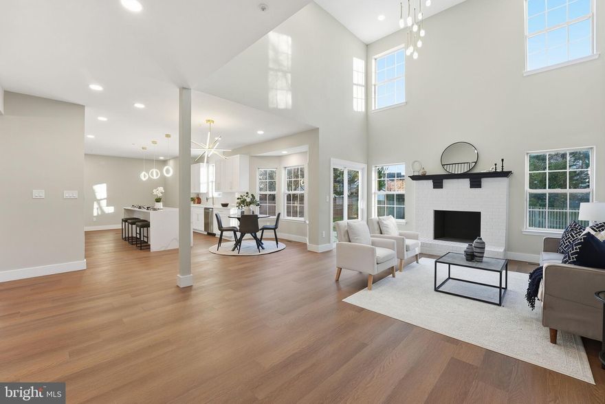 Beautifully renovated brick colonial offering 5 bedrooms, 4.5 bathrooms, and a fully finished basement—designed to deliver modern luxury and exceptional living space in a highly desirable location just minutes to D.C. Step inside to an open and airy layout featuring wide-plank flooring, recessed lighting, and a fresh contemporary palette throughout... The upgraded gourmet kitchen showcases quartz countertops, stainless-steel appliances, stylish tile backsplash, and premium cabinetry—flowing seamlessly into bright living and dining areas ideal for both entertaining and everyday comfort...The highlight of the home is the stunning primary suite, boasting a spa-inspired bathroom with a freestanding soaking tub, oversized walk-in shower with designer tile, dual vanities, gold modern fixtures, and a statement lighting package. All additional bedrooms are generously sized and beautifully updated, offering flexibility for guests, a home office, or multigenerational living.... The fully finished basement expands your living options with multiple flex spaces—perfect for recreation, gym, theater room, or additional guest accommodations—plus a stylish full bathroom for added convenience. A main-level powder room adds function for guests.... Outside, enjoy an updated driveway parking, fenced yard space, and a location that brings urban convenience and quiet neighborhood living together seamlessly. Close to Metro, shopping, dining, parks, and commuter routes.... Completely move-in ready with every detail thoughtfully selected—this is modern living at its finest.... Don't miss your opportunity to check out this stunning home and call it your own!