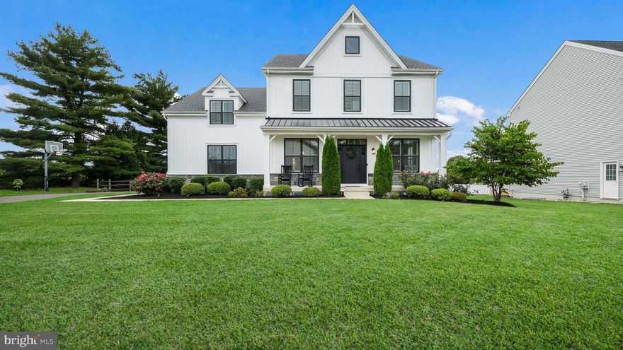 Welcome to Warrington Walk! This stunning 5 year young Gettysburg model offers 4 bedrooms, 3.5 baths, a 2-car side entry garage, and sits on a beautiful half acre lot in a quiet cul-de-sac, within the award-winning Central Bucks School District. Curb appeal abounds with mature landscaping, fenced-in backyard, a long driveway, and an inviting front porch. Step inside to a gracious foyer with tray ceiling, detailed molding, and wide plank wood flooring. To the left is the formal dining room, and to the right a versatile flex room. At the heart of the home, the open floor plan is ideal for today’s lifestyle. The spacious family room features a gas fireplace with wood mantle and custom windows that flood the space with natural light. The gourmet kitchen is a true Chef’s delight—white cabinetry, an oversized two-tone island with seating, quartz counters, farm sink, custom backsplash, stainless steel appliances including double ovens, 5-burner gas cooktop with pot filler, a butler’s pantry with beverage fridge, and a walk-in pantry. A sunny breakfast area with sliders to the backyard completes the space. Practicality meets style in the large mudroom/drop zone with custom built-ins, vinyl flooring, and an adjacent half bath. Upstairs, oak treads lead to a windowed landing and hardwood hallway. The expansive primary suite is a retreat with recessed lighting, ceiling fan, and oversized walk-in closets. The spa-inspired bath offers dual vanities, soaking tub, and oversized shower with wide plank tile. The upper level also includes a convenient laundry room with cabinetry, counters, and sink; a guest en-suite; plus, two additional bedrooms with a shared hall bath. The finished lower level provides even more living space—perfect for entertaining, a game room, or a second family room—plus two unfinished areas for storage. With 9 foot ceilings on all three levels, this home feels spacious throughout. Located within walking distance to Mill Creek Elementary, minutes from Central Bucks South High School, and close to Routes 611, 202, and Doylestown Borough with its shops, restaurants, and museums—this home truly has it all. Schedule your tour today and make Applewood Court in Warrington Walk your next place to call home!