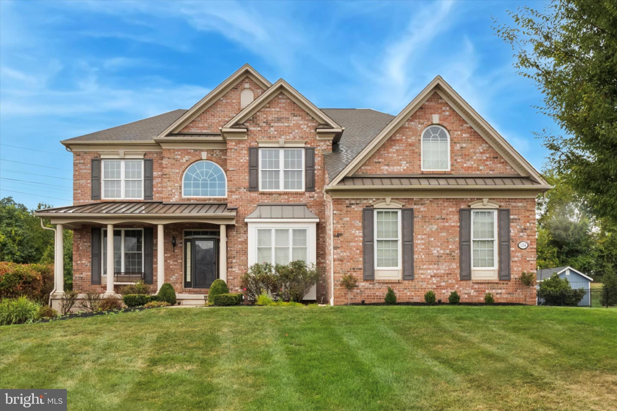 Nestled in the prestigious Riverside at Providence community, this exquisite Colonial-style residence offers a harmonious blend of luxury and comfort, perfect for those seeking an elevated lifestyle. Built in 2013, this home boasts a meticulously maintained exterior of brick and vinyl siding, complemented by lush landscaping and an expansive 0.85-acre lot that adjoins open space and backs to serene wooded views. Step inside to discover a thoughtfully designed interior that radiates warmth and sophistication. The open floor plan seamlessly connects the gourmet kitchen, featuring upgraded countertops, stainless steel appliances, and a spacious island, to the inviting family room adorned with a stunning floor to ceiling stone gas fireplace. Natural light floods the space through skylights and large windows, enhancing the ambiance of the home. The main level also includes formal living & dining rooms, perfect for hosting gatherings, and a cozy breakfast area that overlooks the picturesque rear yard. The additional stairway leads to four generously sized bedrooms, including a luxurious master suite complete with sitting room and a walk-in closet and an en-suite bathroom featuring a soaking tub and a walk-in shower-ideal for unwinding after a long day. Every detail has been considered, from the elegant crown moldings and chair railings to the practical features like a main floor laundry and a fully finished walkout basement, which offers endless possibilities for recreation (game room & exercise room) or relaxation. (bar with 2 tV's and a separate movie room). The wet/dry bar adds a touch of sophistication, making it the perfect spot for entertaining guests. Outside, the expansive deck and patio provide an idyllic setting for outdoor living, whether you're enjoying morning coffee or hosting summer barbecues. The property is equipped with a lawn sprinkler system, ensuring your outdoor oasis remains lush and vibrant throughout the seasons. With ample parking options, including a three-car attached garage and additional driveway space, convenience is at your fingertips. The community offers maintenance of common areas, allowing you to enjoy your surroundings without the hassle of upkeep. This home is not just a residence; it's a lifestyle. Experience the tranquility of nature right in your backyard while being just moments away from the vibrant amenities of the area. Embrace the luxury and comfort that this exceptional property has to offer.