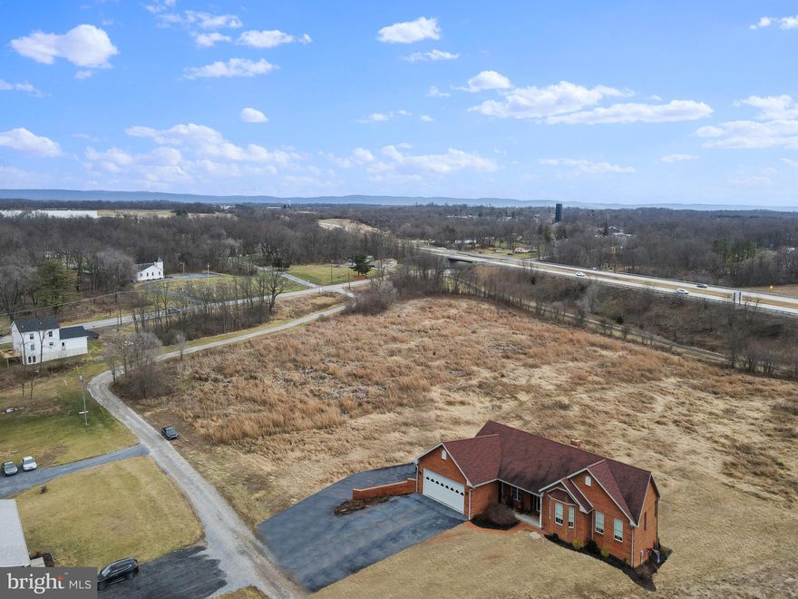 House in pics is a rendering of what could be!  Amazing location with easy commuter access and very light restrictions.  No mobiles.  All home must be on permanent foundations.   Multiple lots ranging from 2.17-4.3 Acres.  Lots are easy to build and all are perc'ed and ready to build.   House packages can be built into price with Henson Quality Contracting or your builder of choice.  Most lots have walk out basement options and multiple house locations.  NATURAL GAS is available in community!  Road Maintenance Agreement in place with fees to be determined by majority vote in community.