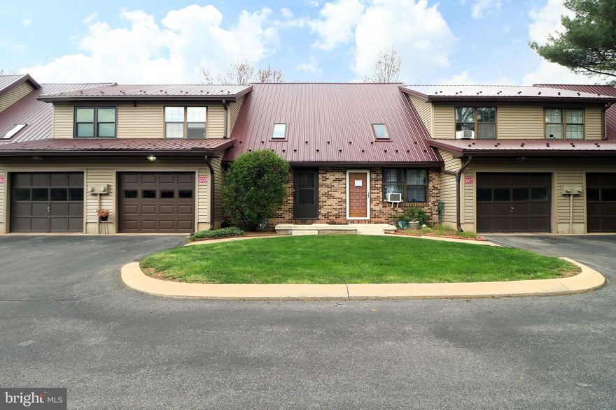 Welcome to this beautifully maintained Park Forest condo in the heart of Northridge. Thoughtfully cared for, this special unit features soaring cathedral ceilings, charming exposed brick walls, and skylights that fill the space with natural light. Step inside and you'll immediately appreciate the open airy feel of the living room, ideal for everyday comfort. The kitchen and dining area are seamlessly connected and lead to a sweet deck. A convenient half bath completes the main level. Upstairs, you'll find a spacious primary suite along with a second bedroom—perfect for guests, a home office, or personal retreat. The fully finished basement expands your living space with a rec/family room, an additional bedroom, full bathroom, and laundry area. Easy access to everything you need. You will be just minutes from schools, shopping, and close distance to Circleville Park and the Park Forest Pool. Enjoy the convenience of CATA bus service and a low-maintenance lifestyle, with a $200 monthly association fee that covers refuse, snow removal, lawn care, and basic cable. 1-car garage