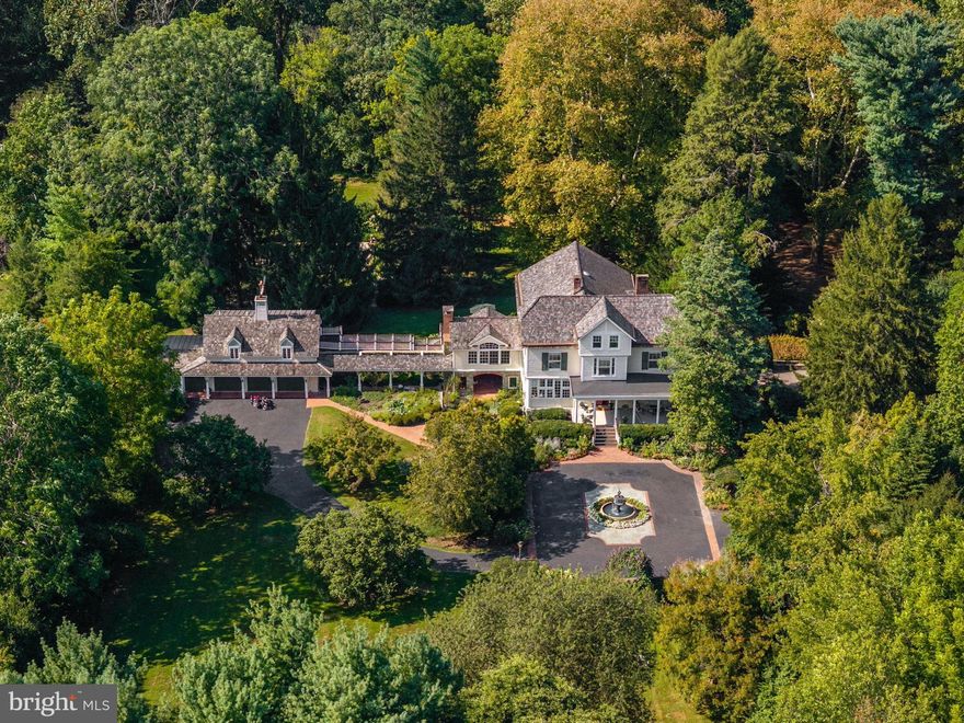 There are houses, and then there are homes that hold entire worlds within their walls. Heartsease, a stately Victorian estate set on 5.25 acres, is one such place. For over a century and a half, it has stood as both sanctuary and stage - its history woven into the lives of those fortunate enough to call it home. The estate’s very name is a story in itself. “Heartsease” was chosen for the home after the delicate wildflower, a symbol of tranquility, joy, and belonging. Like its namesake, the property has always been a place where hearts feel at ease - a retreat where beauty and serenity shape daily life. Originally built in 1869, Heartsease embodies the grace and craftsmanship of its era: a symmetrical façade, a broad and welcoming front porch, and timeless architectural details. Through the years, each generation has left its touch while safeguarding its integrity. Step inside through the iconic red double doors and you’ll find a home that balances heritage with modern comfort, grandeur with intimacy. With four bedrooms, four and a half bathrooms, and an elevator spanning three levels, the house offers both elegance and livability. High ceilings, period woodwork and expansive windows bathe the interiors in natural light. Fireplaces anchor the formal and informal living spaces. A sunlit chef’s kitchen with custom cherry cabinetry and professional-grade appliances centralize connection for elegant entertaining and quiet family evenings alike as it opens to the living room, formal dining room, great room with vaulted ceiling and deck beyond. Upstairs, serene bedrooms overlook gardens and woodlands, inviting a deep sense of retreat. Tucked throughout are quiet corners for reading, reflection, or conversation - each space telling its own story. Additional notable features include a richly appointed wood-paneled office with fireplace, offering an inspiring setting for study or work. The ground level enhances the home’s versatility with a stone-walled drawing room featuring a concealed, state-of-the-art retractable projector screen for theater-style viewing, along with a wine cellar, laundry, garden room with sink, and the original larder - all thoughtfully designed with built-in storage. A full bathroom on this level provides convenience, while doors open directly to the European-style breezeway with hanging swings. From here, enjoy a second access point to the fire-pit patio and hot tub gazebo, seamlessly blending indoor comfort with outdoor leisure. Beyond the main residence, the estate expands to include a detached studio and three-car garage, connected by 1,200 square feet of decks and breezeways. For artists, entrepreneurs, or multigenerational families, this is space with limitless possibility. The grounds of Heartsease are as captivating as the home itself. Specimen trees and gardens - some with plantings that echo the property’s earliest days - bloom in harmony along winding paths and beneath arched trellises, creating a sanctuary of beauty and calm. At the heart of it all, a graceful fountain lends a tranquil soundtrack, while a secluded pool, hot tub, and fire pit invite year-round enjoyment. Yet the landscape is not only for retreat, but also for celebration. With its spacious front porch, expansive lawn, brick patios, broad decks, and pool terrace, the property easily accommodates gatherings of every scale. Few estates combine such natural beauty with this level of versatility, making Heartsease equally suited to private reflection and unforgettable occasions. What truly sets this home apart is not simply its size or its features, but its soul. Here, history and artistry live side by side. It is a place that has welcomed generations - and now, it opens its doors to new stewards, ready to continue a legacy that is both timeless and deeply personal.