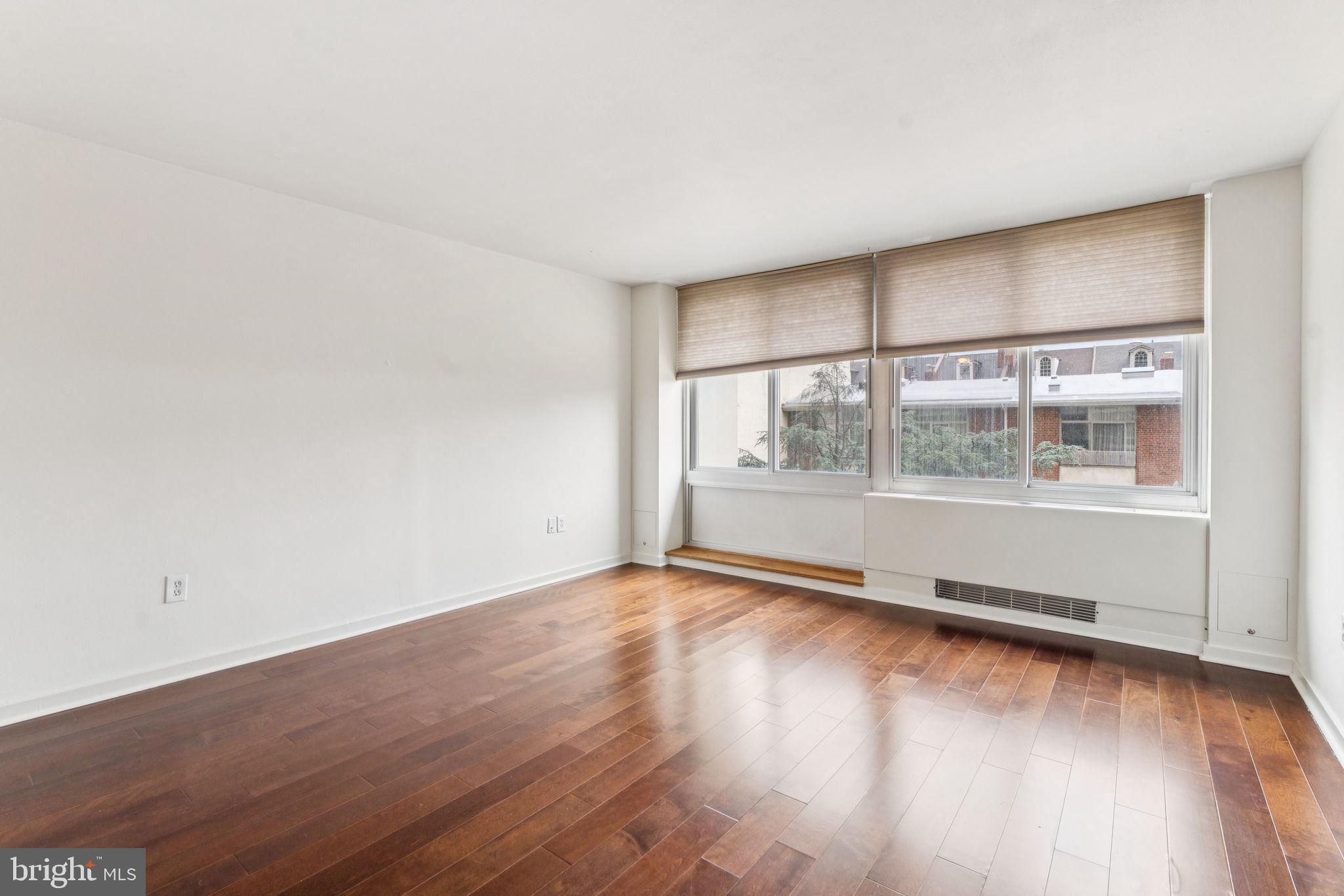 Beautifully updated studio with southern treetop views at Hopkinson House on Washington Square! Enter through a foyer with large coat closet into the spacious great room beaming with natural light from oversized windows overlooking the building's landscaped courtyard. Adjacent is the updated open kitchen with white shaker cabinetry and stainless steel appliances. There is a separate dressing area with excellent closet space that leads to the full bathroom with white vanity, tub shower, and upgraded tile floor. Additionally this home enjoys parquet wood floors and excellent storage space throughout. Residents of Hopkinson House enjoy a 24-hour doorman and on-site management. There is a seasonal rooftop pool with see-forever city views and valet parking in the building for an additional fee, subject to availability. Hopkinson House is in close proximity to many of the city's historic and cultural sites, some of the city's best shopping and dining and provides easy access to the Broad Street and Market Street office corridors, as well as 676, 95, Amtrak's 30th Street Station and the Philadelphia International Airport.