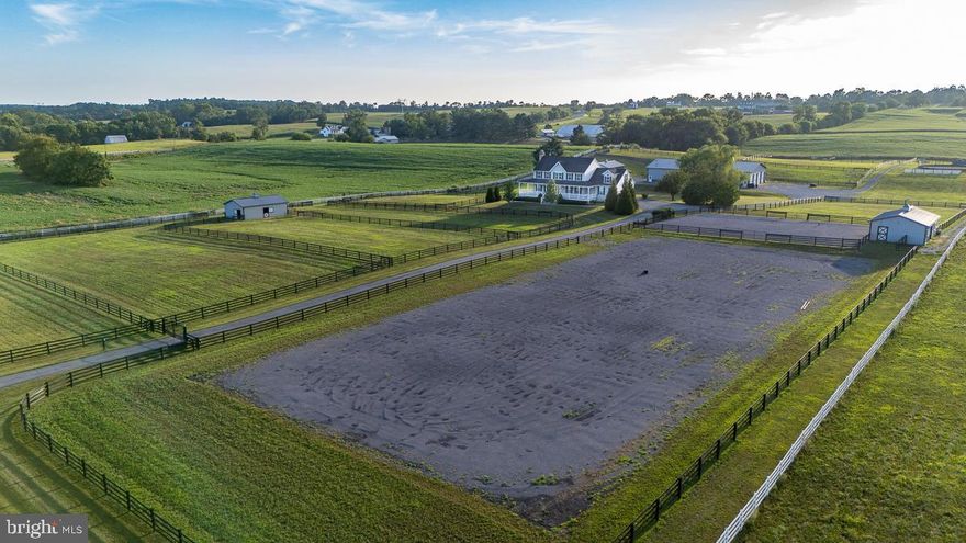 Offered in scenic Union Bridge, this 14.57-acre turnkey horse property is thoughtfully designed for ease, efficiency, and equine comfort. Set among working farms in Frederick County, this facility is ideal for private use or a boutique training and boarding operation.

The farm features three 3-stall (12x24') barns, each with individual run-outs and heated Nelson waterers, 16 paddocks with 4-board flex fence and electric, a Priefert round pen and 100' x 200' arena with bluestone footing. 

The main barn offers 20 matted stalls (13 small, 3 oversized 14x14', and 4 12x12'), heated Nelson waterers, and practical amenities throughout. A large matted wash stall with hot/cold water and swing arm, heated tack room, heated office/lounge, full bathroom, laundry room, 3-bay equipment shed, fully outfitted vet clinic and RV hook-up round out the features of this well-equipped property.

The 3-bedroom, 4-bath Colonial-style home with over 4,000 sq ft of living space includes a private basement apartment–perfect for guests or staff. The sizable living room with pellet stove and three walls of views greets you and opens to a large entertaining area that meets the kitchen. Cooks will be pleased with the Viking appliances and two pantries. The mudroom with wash sink and a half bath are conveniently located just inside the garage entrance for when you return from the barn. A huge laundry room on the bedroom level and expansive primary suite with dreamy walk-in closet and dressing area are an owner's oasis. The wraparound porch and deck provide scenic views of the paddocks and landscape, while the gated driveway with keypad entry adds security for residents and horses alike.

Book a tour today to experience all that this property has to offer!