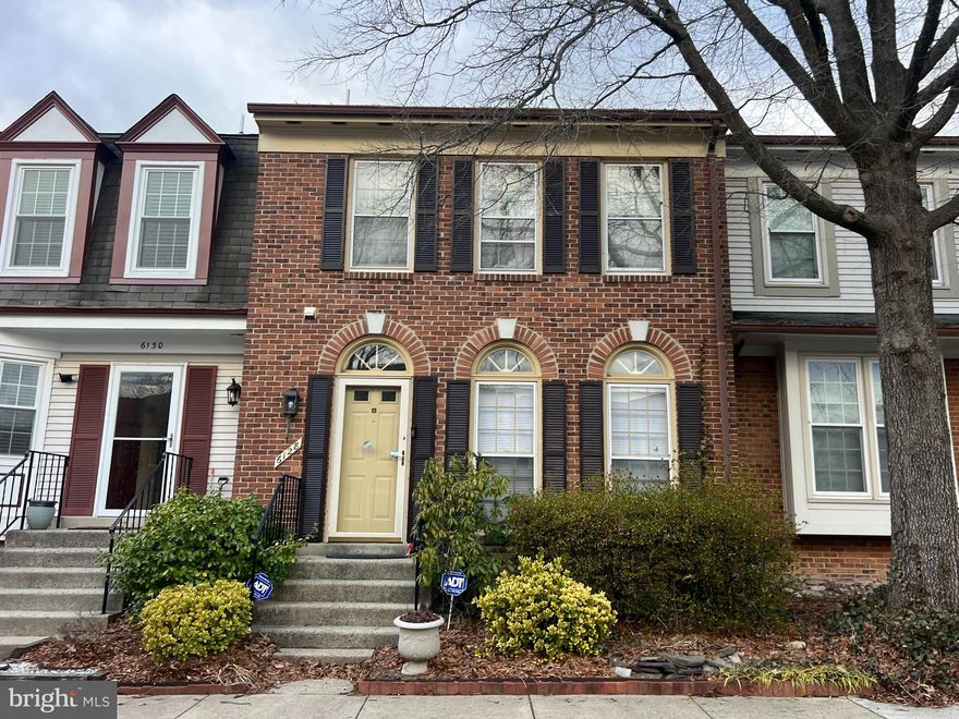 Charming Brick Front Townhome with Scenic Views in Wellington Commons: Welcome to 6128 Wellington Commons Dr., a beautifully maintained townhome offering a perfect blend of comfort, style, and convenience. Step inside to soaring 9-foot ceilings, gleaming hardwood floors, and an abundance of natural light that fills the main level. A welcoming foyer includes a coat closet and a conveniently located half bath. Just a few steps up, the spacious family room flows seamlessly into the kitchen and breakfast nook—ideal for everyday living and entertaining. The kitchen features updated two-tone cabinetry, granite countertops, and a built-in microwave, all in a neutral and inviting palette. From the breakfast nook, step out onto the deck, where you can unwind while enjoying peaceful views of the pond and nearby walking trails. The lower level offers incredible versatility, with a full bath and large den with closet that can easily serve as a third bedroom. The spacious rec room features recessed lighting, and  fireplace, making it a cozy haven. This level also includes a laundry room with extra storage and a walkout to the fully fenced rear yard and patio. Upstairs, you’ll find two generous primary suites, each with vaulted ceilings, ceiling fans, and their own private baths. The home offers 1 assigned space and 2 permits for ample parking. Don’t miss the opportunity to make this light-filled, move-in-ready home yours! ** Please be patient, home will be under some repair/paint and owners are moving out, to prepare for new tenant. Professional Photos Coming Soon! Text for video.