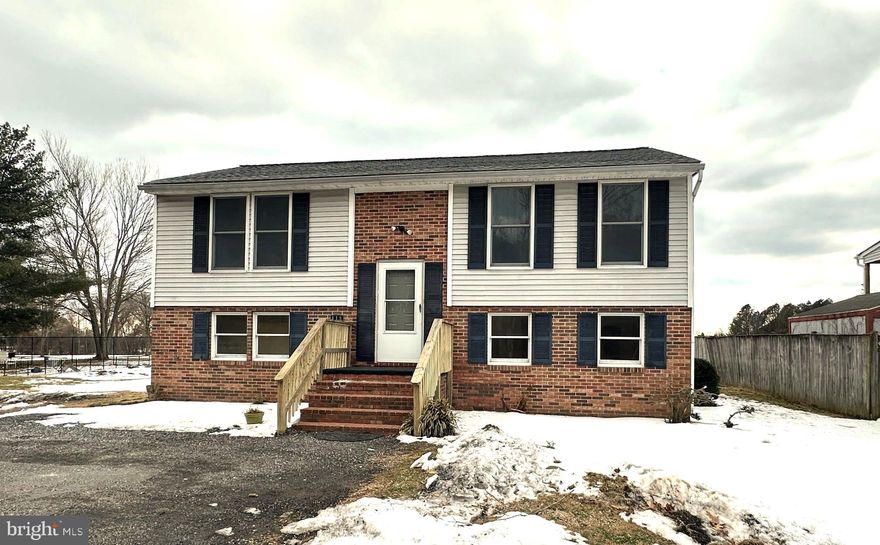 NO HOA! Beautifully maintained 4 bedroom, 2-bath split foyer that backs directly to the golf course offering expansive views of lush green fairways with plenty of space for work, play, and relaxation.  Newer luxury vinyl plank flows seamlessly through the kitchen, family room, hallway, and bath.  The bright kitchen offers a stainless steel fridge and dishwasher and a slider leading out to the freshly painted rear deck.  Two spacious bedrooms and full bath complete the upper level, offering a perfect layout for easy daily living.  The fully finished walkout basement offers 2 additional bedrooms, a large full bath, and another flex room that could be used as an office, playroom, or extra storage.  Ceramic tile foyer.  Lower level laundry.   Oversized parking area.  Right down the street from Cove Point Park.  SOLD AS IS.