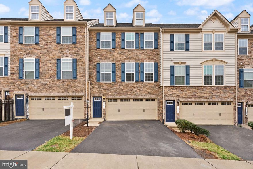 Back on market at no fault of the seller!  Welcome to Wentworth Green!  Nestled in one of Gainesville's most sought after neighborhoods, this 2 car garage townhouse offers the full package and comes with recent upgrades.  Built in 2015, the home shows off an eye-catching stone exterior as soon as you arrive.  Upon entering the main level, you'll quickly notice the open floor plan and how much space there is!  The kitchen features beautiful light cabinets with granite countertops and stainless steel appliances.  It flows into a beautiful main living area with an ideal layout that gets plenty of natural light!  You've also got a lovely dining space with a cute light fixture that steps out onto a fantastic outdoor space.  This home backs to trees for privacy, which you can enjoy sitting on your Trex deck!  Towards the front of the home is a huge space perfect for an office, play room, or more formal dining!  Upstairs you'll find 3 spacious bedrooms, including a picture perfect primary suite. The room features so much space, a beautiful tray ceiling, walk-in closet, and a primary bathroom complete with a double vanity, soaking tub, and standup shower!  Bonus - upstairs laundry, so no lugging clothes up and down the stairs!  The lower level offers a wide-open and very spacious recreation space that walks out to a gorgeous stone patio and private backyard!  You'll also find a magazine worthy full bathroom here with a stunning design.  Recent upgrades include brand new fresh paint throughout (2025), all brand new carpet (2025), basement bathroom buildout (2023), and custom stone patio (2023).  HOA includes fantastic amenities - swimming pool, clubhouse, playground, basketball and tennis court, and walking trails!  The icing on the cake is the location - you're a quick 5 minute drive to Virginia Gateway, one of PW's premier shopping destinations!  Restaurants, clothing and retail stores, BJ's Wholesale, and more!  And with easy access to I-66 and public transportation, you'll have everything you could need.  This property checks all of the boxes so be sure to come see it for yourself!