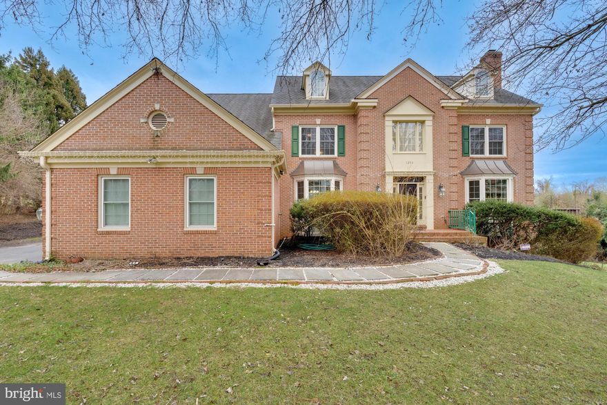 Gorgeous Stanley Martin "MELBOURNE" model home in Vienna on a lovely 0.49 acre lot that is located on a quiet cul-de-sac. This exquisite brick colonial home is one of the bigger models, that boasts 6 bedrooms, 4.5 bathrooms, 3 car side loading garage, and 6,891 square feet. Has around $80K worth of updates in all rooms and bathrooms. Home is furnished with a central vacuum system. Upon entering, you are greeted by a dramatic two story foyer entrance area with a curved staircase, formal living room, and dining room. Gourmet upgraded kitchen furnished with a built-in trash compactor, new gas cooktop, and stainless steel appliances. The main level also features a sunroom that is easily accessible from the kitchen and the two-story family room with a gas fireplace. Additionally, there is a home office overlooking Wolf Trap Park, laundry room, and half bathroom. Upper level luxury owner's suite with sitting room and en suite bathroom with a freestanding tub and shower with in-ceiling Speaker/LED with Bluetooth Wireless Technology. Three additional bedrooms, two full bathrooms and loft area on the upper level. Finished walk-out lower level with recreation room, nanny suite, billiards area, home theater, bedroom, full bathroom, and large storage room. Well maintained backyard that backs to Wolf Trap Stream Valley Park, has an expansive deck, and your own garden of Eden; grape vines; a mulberry tree, fig, banana, and pear tree. Benefit is sharing a pipe stem with wonderful neighbors. Conveniently located on a quiet street in the sought-after Middleton II development and home to many national and international dignitaries, with easy access to Washington DC, and two major airports.