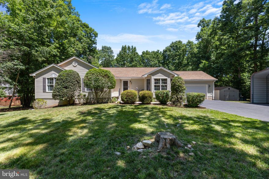 This stunning lake home is beautifully appointed with a 2-car attached garage, plus a boat/carport, which offers a relaxing retreat from your busy everyday life, and provides access to a wide range of amenities for you to enjoy and entertain many friends and family, both inside and out, on an almost-acre lot. 
Move-in and turn-key ready, this house has it all in this thoughtfully designed lake house on the public side (the "cold side") of the coveted Lake Anna in the sought-after Edgewood Bay subdivision, with your very own assigned boat slip (B-9) with a newly rebuilt dock in the nearby common area! Offering the perfect combination of functional and luxurious features from top to bottom in the 3000+ sq ft living space.  
On the main level, you have an open-plan living area that includes a living room, dining room, breakfast bar, and kitchen, plus a large deck for outdoor dining and entertaining. Along with the 4 main-level bedrooms and 2 baths. 
Downstairs, you have a bonus room (currently set up with a queen bed) and a full bath for extra guests, as well as for your home office, crafts, hobbies, exercise, and/or play. Plus, there is an amazing game/recreation room with a gas fireplace to curl up next to on those cool evenings. Then, to top it all off, there is a custom bar complete with a kegerator/beer tap, pool table, & 60-inch HD TV with surround sound that also caters to all your entertaining needs! 
Step outside to unwind and relax on the patio & screened patio, in the hot tub, or throughout the large backyard for all your fun outdoor activities. 
This deal offers a rare opportunity because all the furnishings and decor in the home could convey. Recently updated (2023) Lennox Dual Fuel System (a home comfort system that pairs an electric heat pump with a gas furnace).
Oh, and Lake Anna was recently ranked in the top spot in the nation for owning a short-term rental! 
Don't miss out on the special opportunity to live in a place that combines the beauty of nature with modern conveniences. 
Call now to schedule your viewing of this amazing home in Lake Anna!