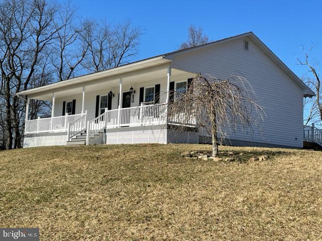 Beautiful ranch home in rural setting with spectacular views. Positioned on a one+ acre lot, enjoy country living without being too far from town. Be the first to live in this lovely home! The entire inside is BRAND NEW! Open floor plan showcases the gorgeous modern kitchen with breakfast bar, the dining room and family room. Relax with your morning coffee on the covered front porch and entertain your guests on the rear deck. Full basement allows for ample storage or future finished living space. Call today for your personal tour!