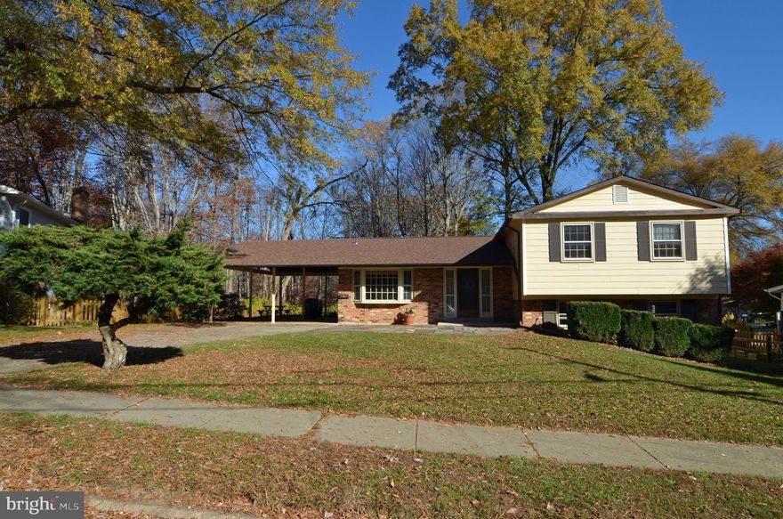 Location is everything - conveniently located in a beautiful close in NOVA treed neighborhood. Sited on a 1/3 acre lot and  backs to acres of parkland and trails  - Long Branch Park.  Enjoy your deck overlooking nature at its finest. Our home needs a bit of TLC but it has great bones. We have 4 levels with oak hardwood floors on 3 levels, 4 bedrooms up, master bedroom with an updated bath,  family room with raised brick wood burning fireplace. main level living room and formal dining room, eat in kitchen and an unfinished basement - great for storage or a game room. The home can easily be made into a great place to entertain by creating an open floor plan for the kitchen, living and dining rooms. Our home is an estate sale and is sold "as is".  Updates are hot water heater(20) and roof(18).