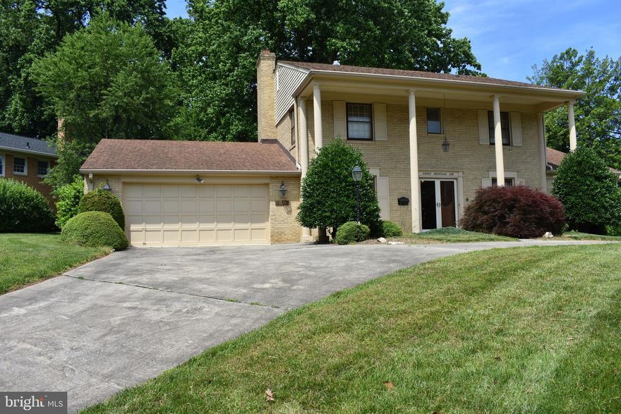 Welcome to this iconic Kenwood Park custom colonial, prominently perched and stately situated, atop this most regal corner lot. Already exuding with charm, either move right in, or bring your interior design imagination and tailor this handsome house into your new dream home. Substantial untapped and instant equity realized with any modest renovation. Done your way!  Amenities include a sunken formal living room, dine in kitchen with breakfast bar, extra large family room, beamed ceilings, gorgeous hearth, fireplace, and French doors to a custom cozy addition/In home office. Four upstairs bedrooms, with ample closet space and two full baths. Finished basement which includes 2 walk'in cedar closets, bar, a half bath which could easily be turned into a full bath the basement has a separate side entrance for easy conversion to private living quarters if desired.  Powder room & Laundry Room on main level. Two car attached garage, Circular driveway and a large wrap around entertainment deck, overlooking a tranquil rear yard. Premier Bethesda suburb location, two blocks from Walt Whitman High School! Yes, that s two short blocks to Walt Whitman High School. Conveniently  located, 10 min drive to NIH , 7 Min Drive to downtown Bethesda, central access to DC, Virginia.