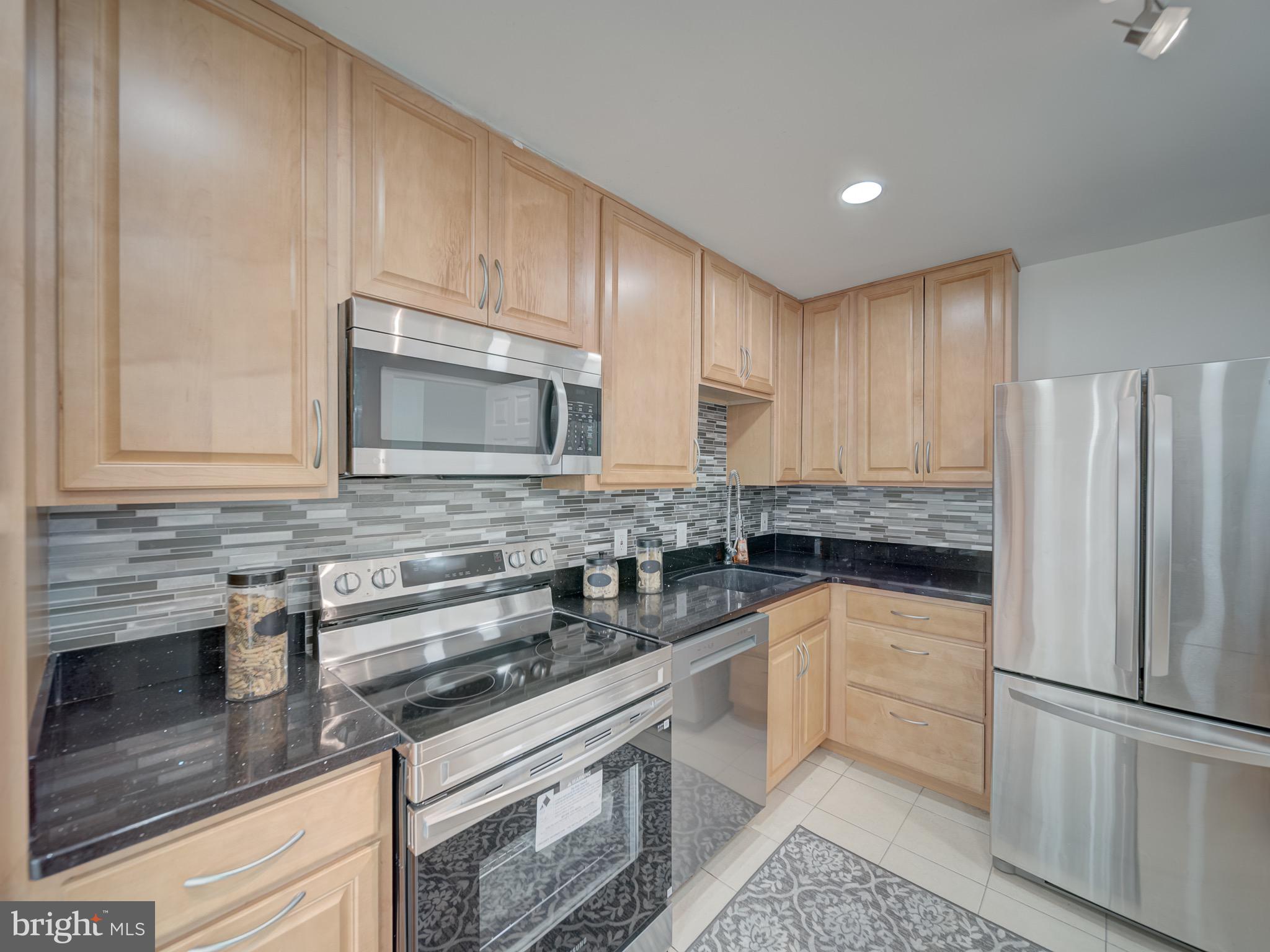 This condo is 100% ready for Your buyers!!This lovely Fifth-floor beauty has been beautifully redone at Columbia Towers. This Condo features a Semi Open-concept kitchen and living area & Dining area flooded with lots of natural light. This luxurious condo offer 2 very spacious bedroom, 2 remodeled baths withJacuzzi jet tub with tasteful tile work . also 42" upgraded kitchen Cabinets, granite countertops, Updated stainless steel appliances, Top of the line engineer wood flooring throughout the entire condo, almost new windows, Upgraded granite vanities, updated fixtures, recess lighting, large closets , spacious balcony and lists goes on and on... Your buyers will Enjoy the peace of mind in a secure building that offers a community pool and club room. It is also perfectly positioned just off Route 29, what make this a commuters dream with quick access to the ICC, 495, and the metro, making downtown Silver Spring, DC, and Baltimore just minutes away.