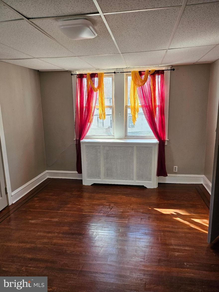 This is NOT the whole house for rent. It is a very large 2BR apartment. Bright and beautiful upper floor unit #B with gleaming refinished hardwood floors, new carpet on stairs and  in bonus room or BR off kitchen, nice kitchen, washer/dryer and a huge attic for a 2rd BR above the living room. Or use your imagination and configure as you like. This unit is very large and has 1.5BA. It is bigger than most row homes for rent and in a great  shape. Just a short distance to the Yeadon Septa, several bus lines right on the street and if you drive, you get 1 dedicated off street parking spot. East Lansdowne/Yeadon neighborhood with single homes close to everything you want to enjoy.  Don't miss out on calling this place your next home - schedule your showing today!!!