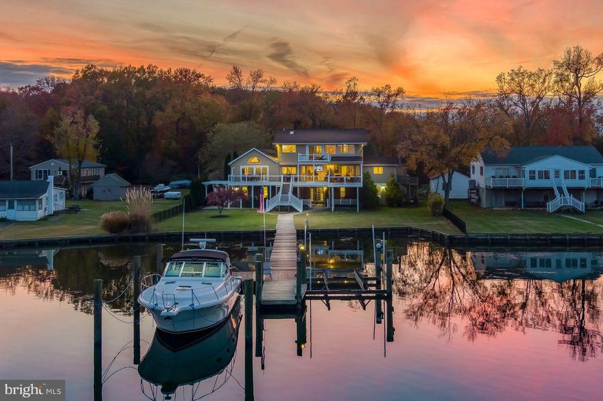 Rare Opportunity to own a Double Lot Waterfront Home located in Bowleys Quarters Maryland. 
With over 5000 square feet of indoor living space, and over 2000 square feet of outdoor living space consisting of covered porches, sun decks with maintenance free decking recently replaced in 2021 and paved patio terrace space including Hot Tub purchased in 2016. 4 Bedrooms, 4 Bathrooms 2 car attached garage and 2 car detached garage. Ample parking for 8 plus cars. Fence yard. 110' pier including private dock and equipped with a 20,000 pound electric Magnum Boat Lift purchased in 2016.  Recently renovated with 8 zoned HVAC. Upgraded 200+ amp electric in 2016. Open spacious kitchen and dining room with lots of glass for amazing panoramic views of Seneca Creek. 18 feet by 20 feet Sunroom with more panoramic views of Seneca Creek. Master Suite located on second floor overlooks Seneca Creek with spacious walk - in closet, shower and jacuzzi soaking tub.  2 Bedrooms on the main floor and 4th Bedroom located on lower level. Lower level above ground with multiple entries. Kitchen features Granite and Stainless, the appliances were replaced in 2020.