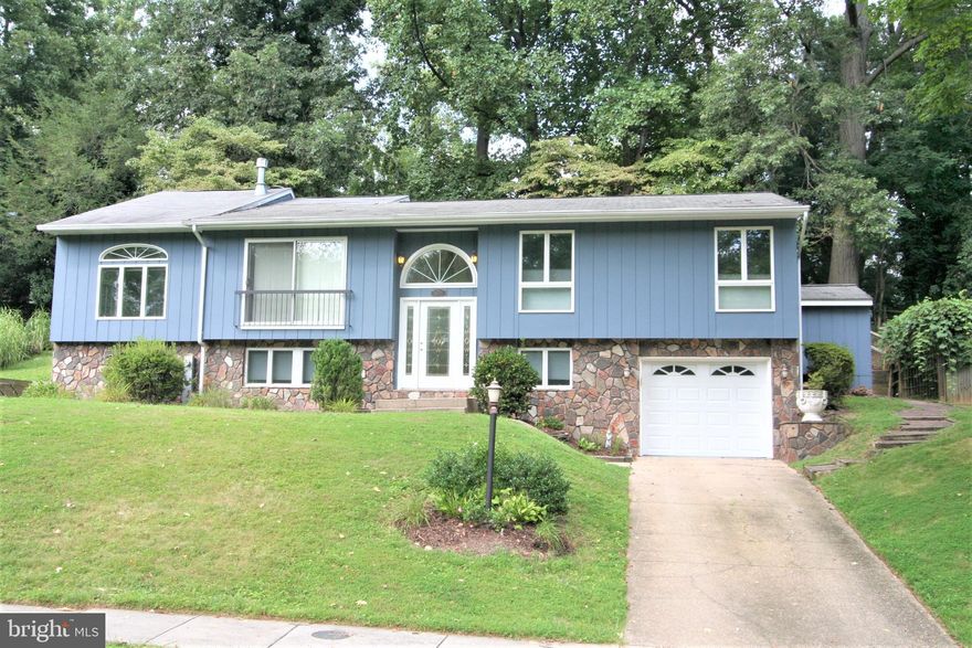 Exquisite, Custom, Split Foyer House with tremendous additions!  Seller has ADDED 650 sq. ft. in additions to this lovely house! A Large, Welcoming Front Yard, on a quiet cul-de-sac,  for all of your fun and games as well as your outdoor gatherings! 4 Bedrooms, 3 Full Baths in the spacious home.  Located in sought after Howard County!  Open and Inviting, the Living Room, Dining Room and Bonus Room with Custom Arched windows and Cathedral Ceilings!  A wall of windows along the back of the house were an added delight to this beautiful home!    The Kitchen is updated and also has an addition with full back windows and access to the back yard! This is the perfect spot to observe and listen to the beautiful array of birds. The Kitchen has mostly Stainless Steel appliances with lots of cabinet space! Skylights and Cathedral Ceilings as well!  The lower level bedroom has a cedar closet with shelving.   There is a workshop in the very clean utility room.  There is an awesome walk-in shed with a concrete floor and electric.  There is also a storage room apart from lower level.  One car garage and a long driveway! Columbia has so many walking paths and playgrounds!  You have FOUND YOUR DREAM HOME!