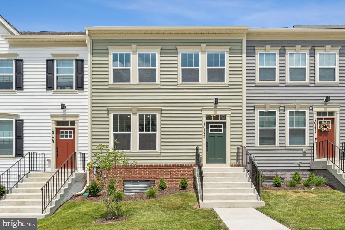 Ready Now! - Welcome to 10173 Kings Grove Way! New construction townhome that backs to serene woods and offers 2,120 square feet of beautifully finished space across three levels. It features an oversized rear-loading two-car garage, three spacious bedrooms, two full, and two half baths, and a rear composite deck for outdoor relaxation. The center kitchen is a highlight, with gourmet appliances, an impressive 11' quartz island, and ample storage. The great room flows effortlessly into the separate dining area, creating a welcoming, open floor plan perfect for everyday living and entertaining. This home combines modern design with thoughtful details—ready for you to move in and make it your own! Schedule a tour today! Builder incentives available for a limited time!