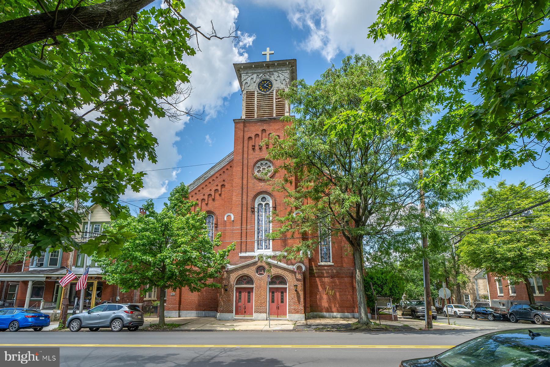 Rare opportunity to own and redevelop a stunning 7,000+ sq ft former church in the heart of downtown Pottstown—now with plans to convert into a 14-unit apartment building. Built in 1859, this historic brick structure features soaring cathedral ceilings, stained-glass windows, multiple floors, and architectural charm throughout. The existing layout includes large open areas, classrooms, offices, and two full basement levels—perfect for reimagining into residential units with character.
Located just steps from High Street’s shops, restaurants, and public transit, the property sits on a 0.16-acre lot and is zoned TTN/INST. Utilities include public water/sewer and radiator heat (gas/oil), with parking via shared driveway and street. All zoning and development approvals are in place, offering a ready-to-go adaptive reuse project in a growing market. Whether you're an investor, builder, or visionary developer, 79 N Hanover Street presents a unique and shovel-ready multifamily opportunity in the heart of Pottstown. THIS BUILDING IS SOLD WITH 148 Chestnut St, Pottstown, PA 19464 INCLUDED