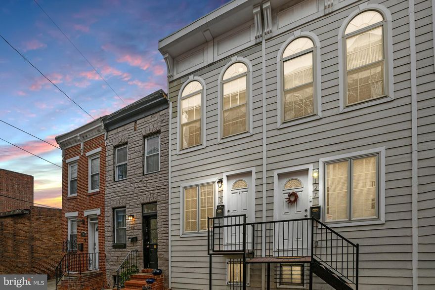This charming townhome, nestled in the heart of Baltimore's historic Butcher's Hill community, offers a perfect blend of modern updates and classic character. As you enter the home, you're immediately greeted by beautifully refinished hardwood floors that run seamlessly throughout the main level and upstairs, adding a warm and inviting atmosphere to the space. The main level flows effortlessly from the living room into a spacious dining area, with an open connection leading to the kitchen. The kitchen is a true highlight, featuring sleek granite countertops, plenty of cabinet space, and ample counter space to make cooking and entertaining a breeze. Whether you're preparing a family meal or hosting friends, this kitchen is designed for both style and function. On the lower level, you'll find brand-new luxury vinyl plank (LVP) flooring, offering durability and easy maintenance. This flexible space could easily serve as a cozy family room, a home gym, an office, or whatever your imagination desires. The lower level also includes a full bathroom and a convenient laundry area, providing additional functionality for day-to-day living. Upstairs, the home continues to impress with two spacious bedrooms, each bathed in natural light from large windows that highlight the high ceilings. The second floor also features a full bathroom, ensuring comfort and privacy for both bedrooms. One of the bedrooms opens up to a private balcony, perfect for enjoying morning coffee or winding down at the end of the day with views of the charming neighborhood. With its thoughtful layout, modern finishes, and prime location in Butcher's Hill, this townhome offers a comfortable, stylish, and versatile living space that’s ready to welcome its next owner. Conveniently located near Patterson Park, John Hopkins Hospital, Shopping, restaurants, and minutes away from major highways this property has everything you need! The unit is certified as Lead-Free and the certificate is valid indefinitely. ** Some pictures have been virtually staged***