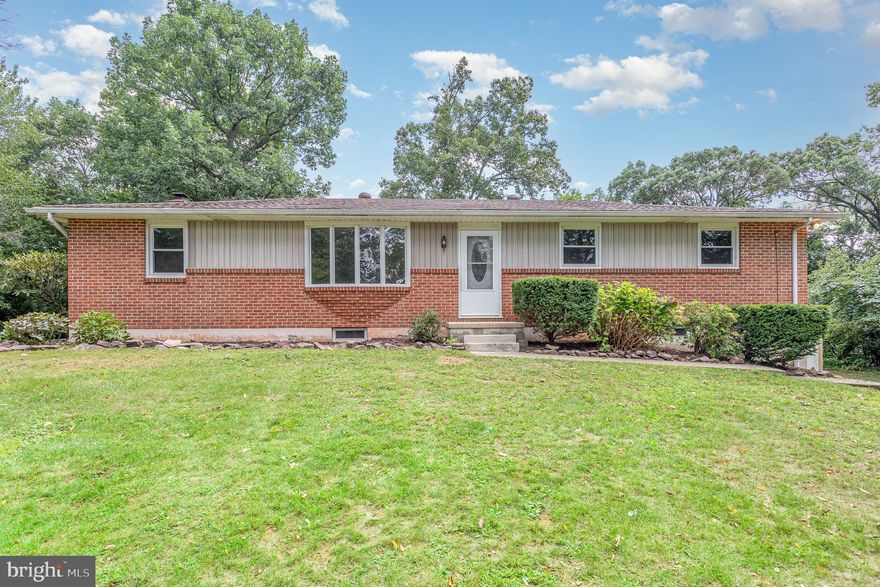 Nestled on a secluded lot in Dover, this captivating 3-bedroom, 1.5-bathroom brick rancher offers the perfect blend of comfort and convenience. Freshly painted with stylish vinyl flooring, this home welcomes you into a world of warm natural light in the front rooms, enhanced by a cozy fireplace perfect for Pennsylvania winters. The heart of the home is adorned with stainless steel appliances, granite countertops, and a chic tile backsplash. The finished basement provides ample space for entertainment or a home office, ensuring you have all the comfort you need. Step outside to discover a sun-soaked sunroom leading to a spacious deck overlooking a private backyard, offering a serene retreat for relaxation or hosting gatherings. This property also features an attached two-car garage, complemented by a large detached garage, providing plenty of space for vehicles and storage.  There are two separate tax parcels giving you a total of 1.47 acres. Don’t miss out on this unique opportunity to own a slice of tranquility in Dover.