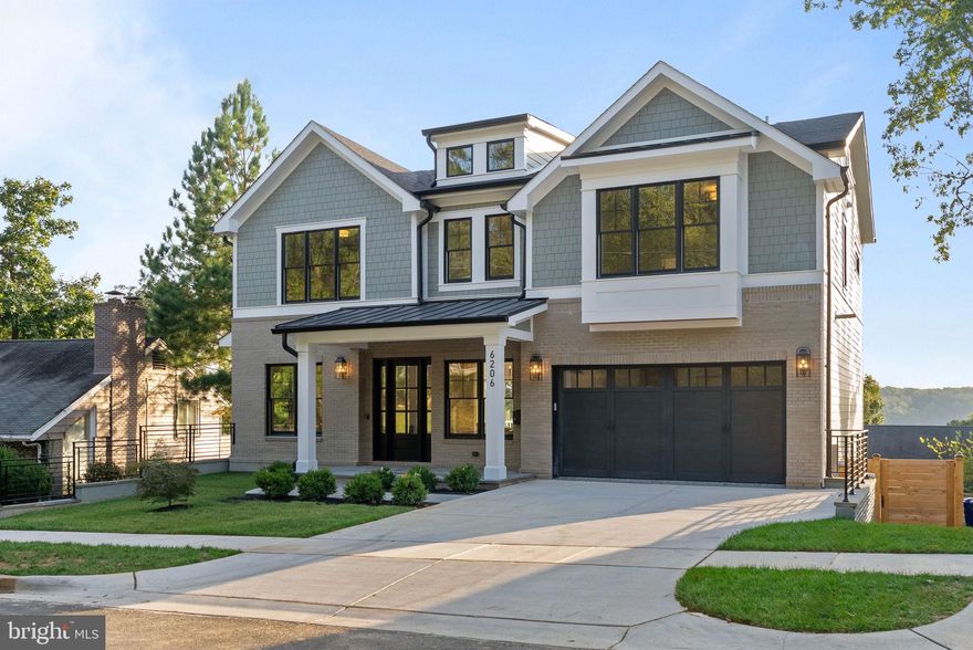 Welcome to 6206 Crathie Ln, a newly constructed luxury home in the heart of Bethesda offering sophisticated design, exceptional views, and an unbeatable location. Thoughtfully crafted in a blend of Craftsman and Colonial architecture, this 5 bedroom, 6 bathroom residence spans over 5,455 square feet and sits on a 7,207 square foot lot in a peaceful, established neighborhood.
Inside, you'll find warm wood tones, expansive windows, and streaming natural light that together create a calm and inviting atmosphere throughout. Each of the five generously sized bedrooms features its own private ensuite bath, offering comfort and privacy for family members and guests alike. The sleek, modern bathrooms are appointed with designer fixtures and elegant finishes, as showcased in the spa inspired primary suite.
The open concept main level is perfect for entertaining, flowing seamlessly to a rear deck with serene treetop views. The true showstopper? An expansive rooftop deck offering a rare vantage point over the Bethesda landscape — perfect for sunset cocktails, morning coffee, or stargazing with friends.
The gourmet kitchen, oversized mudroom, and epoxy finished two car garage round out the impressive functionality of the home. Additional highlights include a potential home office space, designer lighting throughout, and thoughtful storage.
Situated within minutes of top rated schools, shopping, and transit access to Downtown Bethesda, DC, and Northern Virginia, this move in ready home offers the perfect balance of tranquility and convenience.