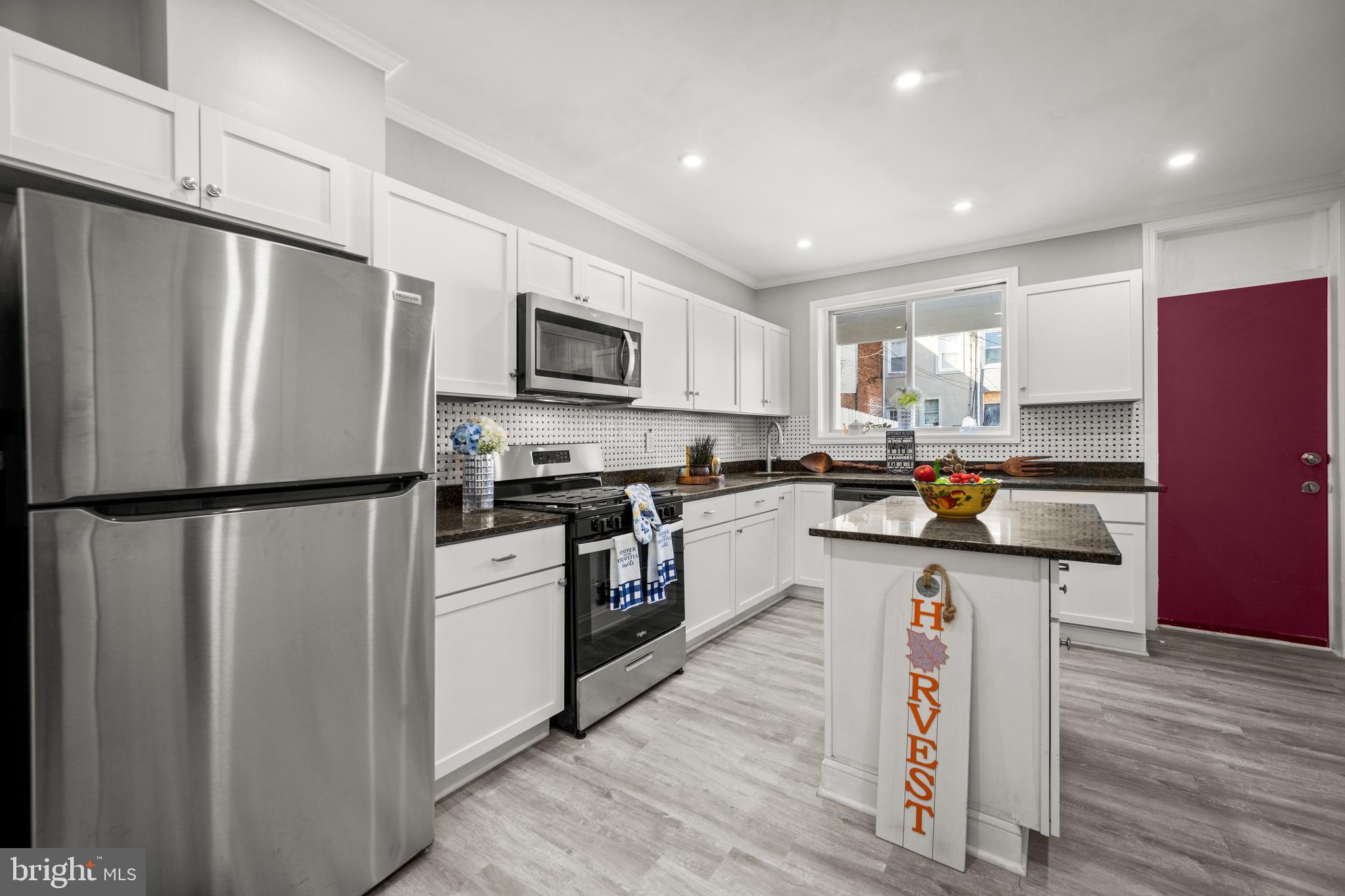 Discover the charm of this classic home nestled on a picturesque tree-lined street in the heart of Pigtown. This beautifully updated residence is a must-see for discerning buyers seeking comfort and modern convenience.
Step inside to find luxurious vinyl flooring gracing the main level and plush carpeting upstairs, all freshly painted to enhance the abundant natural light that illuminates every corner. The upper floor boasts three bedrooms, including a versatile space perfect for a nursery or home office. The primary suite features a private bathroom with a skylight, offering a serene spot to enjoy stunning views of the sky while you unwind in the shower or tub. An additional hallway bath serves the remaining bedrooms.
The spacious and open first floor is designed for modern living, featuring a half bath and a flexible dining area that can easily transform into a cozy sitting room or media center. Imagine the possibilities with potential for a parking pad at the rear of the property. This space has been enclosed for privacy and can facilitate extensive family and friend gathering as the seasons change. It is a MUST SEE!!
This home has seen numerous updates, including modernized plumbing and electrical work, along with a fully renovated kitchen and bathrooms. The well-maintained silver-coated rubber roof adds to the home's impeccable upkeep. Move-in ready, this space invites you to personalize it and make it your own.
Located just moments from downtown attractions like the Inner Harbor, Camden Yards, M&T Bank Stadium, and the University of Maryland Medical Campus, you'll enjoy easy access to entertainment, dining, and culture. Plus, with eligibility for Live Near Your Work Grants, this home presents an excellent opportunity for both convenience and savings.
The main-level laundry can be effortlessly relocated to the finished basement, which offers additional space for a recreation room or lounge area. Don’t miss out on this incredible opportunity to own a piece of Pigtown’s vibrant community, just steps away from its bustling business district. This home is not just a 10/10—it’s the perfect place to create your future. Schedule a visit today and experience its allure firsthand!