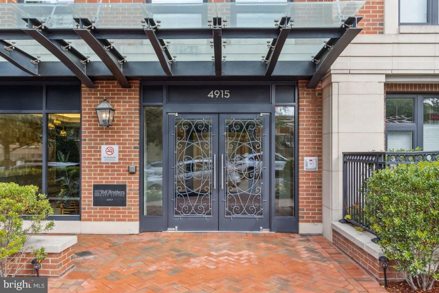 Light and bright 2 bedroom + den, 2 bathroom unit in sought after Hampden Row Condominium in Downtown Bethesda. This 6 year young Toll Brothers community is an amenity rich building in prime location of Downtown Bethesda. Open concept living - enter into the foyer with views of the living/dining area. Large island with white shaker cabinets, stainless steel appliances and barstool seating. Table space off the kitchen. Den/office space off the kitchen with luxury grasscloth wallpaper. Bright light filled living area with great sight-lines. Secondary bedroom with large windows and walk-in closet. Large hall bath with private laundry. Hotel like primary suite with large windows, large walk-in closet, spa like bath with double vanity, step-in shower with rain shower head. G-level has meeting room, tv lounge and entertaining space. Rooftop deck with multiple sitting areas, grilling area and stunning views. Rooftop gym with city scape views. Private parking on G-2 and bike storage room. Concierge and on-site property manager. Just around the corner form the new Salt Line restaurant (any many many more), Bethesda Metro,  Bethesda Library, Bethesda Row and so much more!