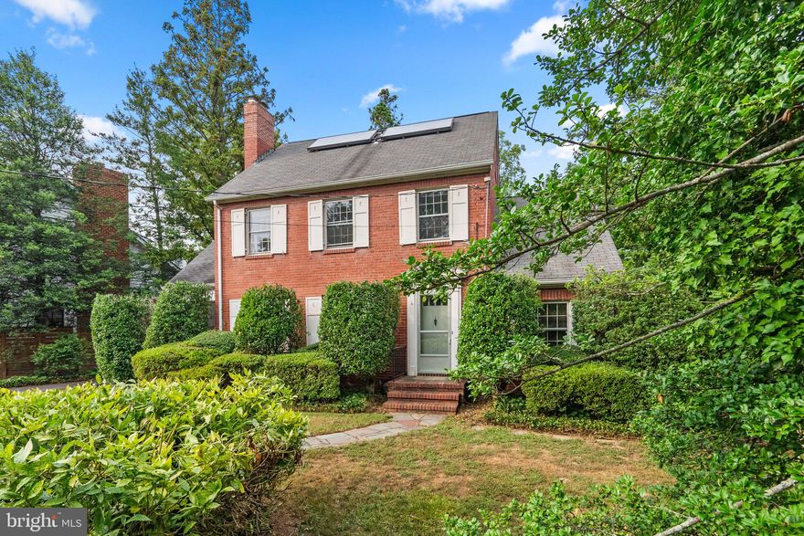 Welcome to 411 E Jefferson Street, a classic, vintage home nestled in the heart of the City of Falls Church, known for its top tier schools, access to two metro stations, biking/jogging trails and walkability to shops and restaurants! This solid brick home, built in 1937 sits on over a third of an acre and backs to parkland and the scenic Four Mile Run Trail. Inside, the home retains much of its original charm including oak hardwood floors, extra-wide moldings and trim, and a delightful side porch. Off the entry foyer is a separate office, a powder room, and a spacious living room with a wood-burning fireplace flanked by windows and a glass door opening to the porch. The sizable dining room has chair moldings and a built-in corner cabinet. The owner expanded the home approximately 30 years ago adding a large kitchen/family room addition with French doors, cathedral ceilings, an exposed brick wall, abundant cabinetry, two sinks, and a large island and the original kitchen was retained as a large butler's pantry. The family room, complete with its own wood-burning fireplace, offers views of the backyard and glass doors lead to a generous deck. Upstairs, you'll find the primary bedroom with an ensuite bath, 3 additional bedrooms and a hall bathroom. Here you also have access to the fully floored attic, great for storage or expansion. The finished basement provides added space for a rec room, workshop, and laundry area, plus a door to access the backyard with a potting shed and a gate leading directly to the park and trail for a short, 10-minute walk to the East Falls Church Metro. Situated on a quiet cul-de-sac, from here, the Falls Church farmer's market, the new Whole Foods at Broad & Washington, and an array of great shopping and dining options are steps away. While this lovely home needs updating, the location, vintage charm, and floor plan create the perfect canvas that today's discerning buyers are looking for, welcome home! Property is being sold as-is.  OFFERS, IF ANY, ARE DUE AT 5 PM ON MONDAY, AUGUST 12.