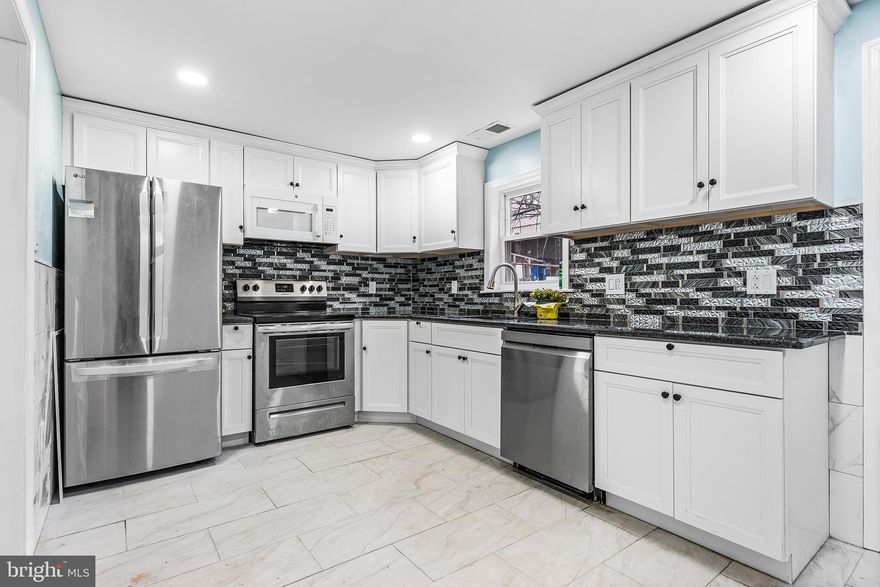 This beautifully updated home is move-in ready and waiting for you! It features 2 bedrooms and 2 full bathrooms, with numerous improvements completed in 2025. The main level features an open-concept living and dining area with recessed lights, brand new hardwood flooring, creating a bright and functional space for everyday living and entertaining. Hardwood floors continue throughout the upper level.  The modern kitchen was fully renovated in 2025 and features white cabinetry with crown molding, along with new stainless steel appliances including a new refrigerator and dishwasher. The finished basement provides valuable additional living space and includes a full bathroom, plus a dedicated laundry and storage area. Major upgrades completed in 2025 include Central Air, new hardwood flooring, a fully renovated kitchen, all new windows, new washer and dryer, a new hot water heater, and fresh paint throughout the entire home. Conveniently located in South Philadelphia with easy access to the restaurants, cafés, and local shops along Passyunk Avenue, as well as public transportation and Center City. The South Philadelphia sports complex including Lincoln Financial Field, Citizens Bank Park, and Wells Fargo Center along with FDR Park are also just minutes away. Schedule your showing today.