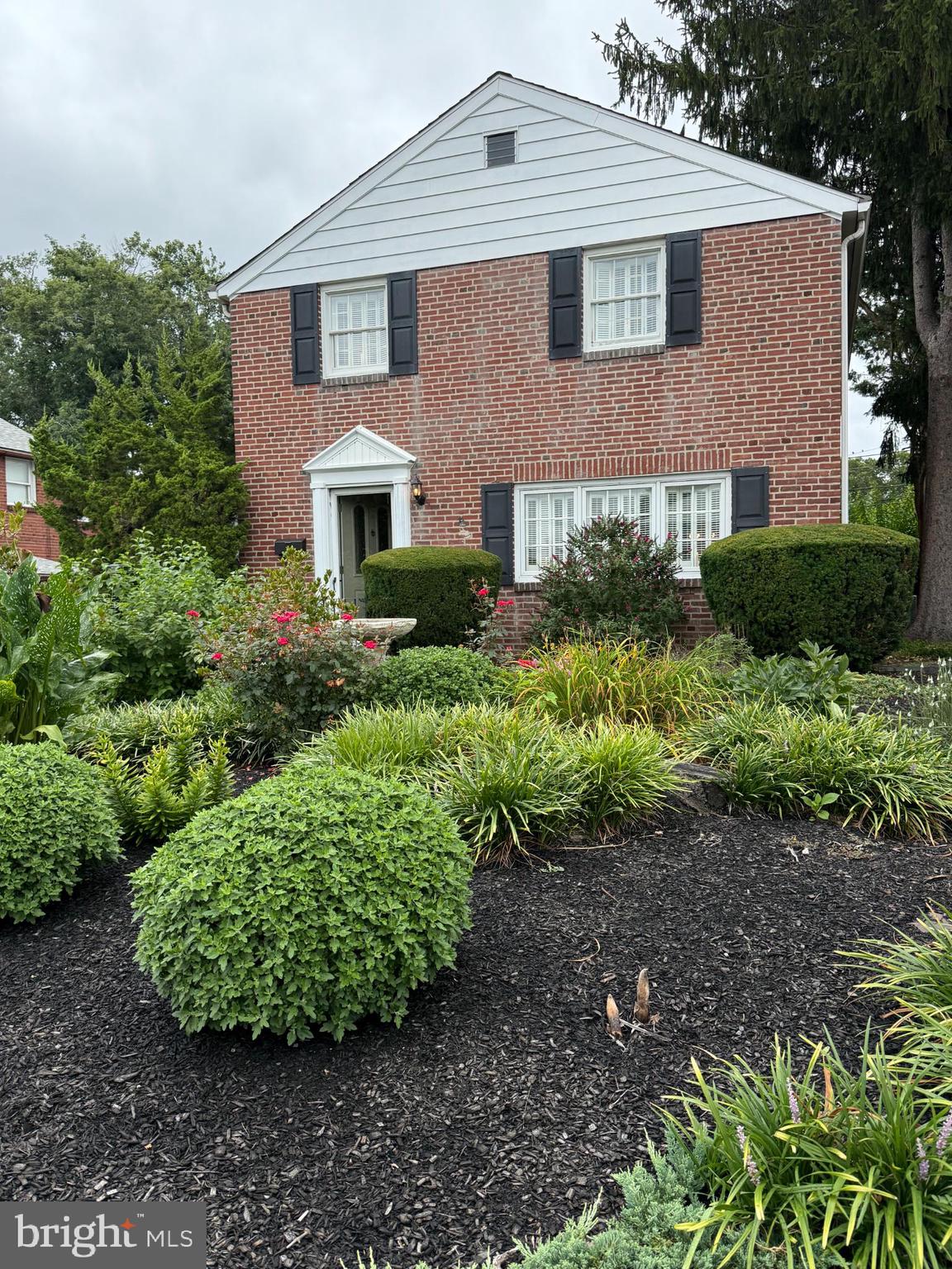 This charming traditional brick home, built in 1950, offers a perfect blend of classic design and modern comfort. It has been meticulously maintained over the years, but it's time for it's new owner! It has terrific curb appeal with it's beautiful landscaping. With four spacious bedrooms and two full bathrooms, this residence is designed for both relaxation and entertaining. Step into the home and enter the spacious living area with a beautiful front window and built in shelves that adjoins to the formal dining room. The charming kitchen and breakfast table space will make morning coffee a delight. Or, relax in the screened in porch just off of the kitchen on the side of the home. Down the stairs is the convenience of a partially finished basement, ready for years of fun and memories, but also includes a workshop area, perfect for hobbies, dedicated office or additional storage. The laundry facilities are conveniently located in the basement, ensuring ease of use. Upstairs are three good sized bedrooms that share the hall full bath. A big differentiator of this home is the built on addition of the fourth master bedroom and full bath complete with vaulted ceiling and massive window allowing sun light to drench the room. The attached garage offers covered parking, while the paved shared driveway accommodates additional vehicles. Located in the middle of the block, this home is just a short drive from the airport, enhancing its accessibility. The property is in excellent condition, ready for you to move in and make it your own. The central HVAC system was replaced three years ago! With no HOA fees and a variety of nearby shopping and restaurants, this home is a fantastic opportunity for those seeking comfort and convenience. Experience the warmth and charm of this delightful residence-your new beginning awaits!