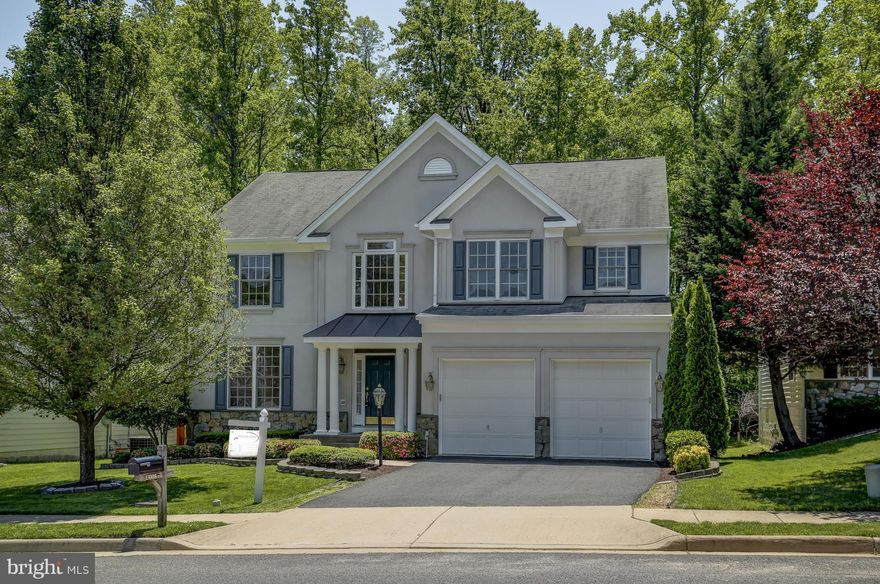 GORGEOUS Model home***BRIGHT SUNROOM with 2 sided FIREPLACE leads to Deck and yard backing to woods**SUNROOM AND BASEMENT**H/W flrs, New Carpet & New S/S Appliances**Large Bedrooms*Huge Kitchen with Island & table space, Sep. Dinning Room, Over 4,361+ Finished sq ft**W/O Basement W/ wetbar and room w/ Full Bath*