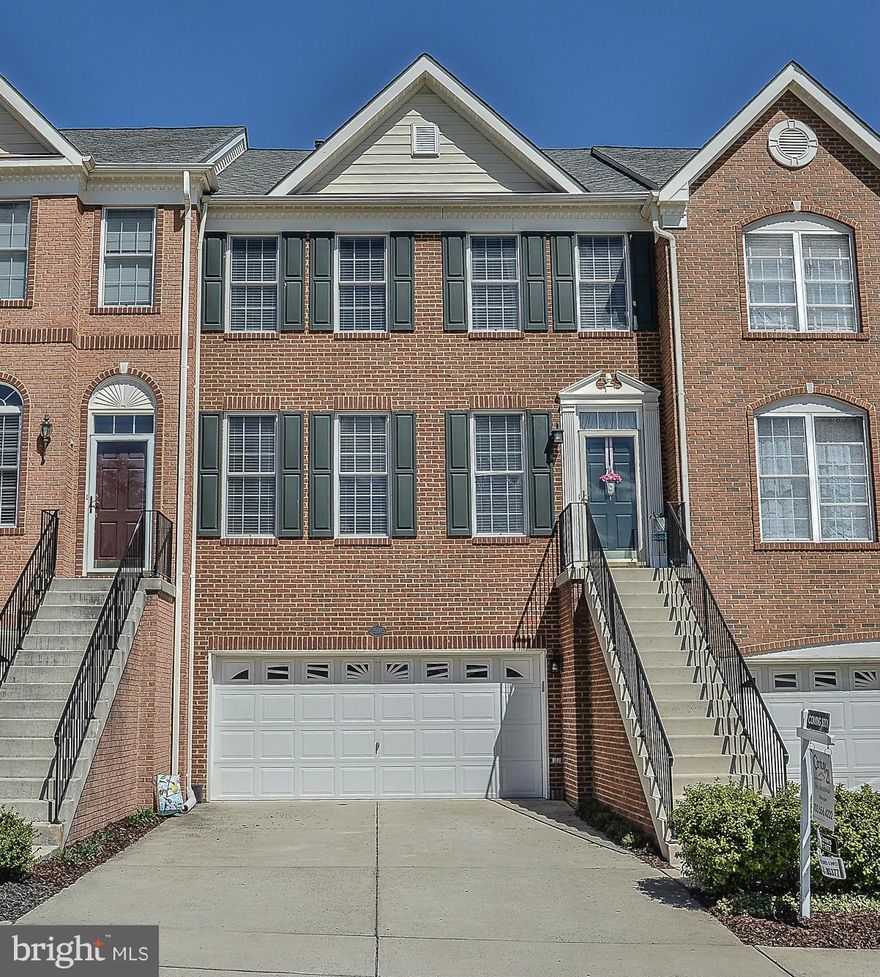 NEW LISTING! Stunning brick front townhome in South Riding! Picture perfect & impeccably maintained! Open floorplan features include hardwood floors on main level, 3 level bump-out, huge kitchen w/ island, sitting room w/ gas fireplace & breakfast nook. Vaulted ceilings on upper level. Huge luxury master suite w/ dual walk-ins, soaking tub, separate shower. Walk-out basement. Deck & fenced yard.
