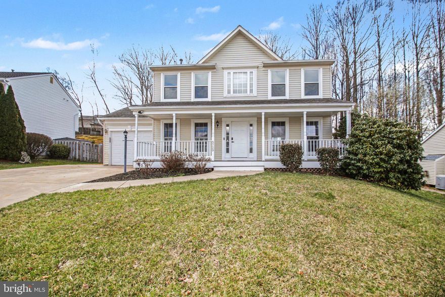 Welcome home to this charming colonial retreat where comfort, character, and everyday living come together beautifully—with no HOA and a fully fenced backyard for your own private escape. From the moment you arrive, the expansive front porch invites you to slow down, sip your morning coffee, and stay awhile.

Inside, you’re greeted by a light-filled, welcoming layout accented by luxury vinyl plank flooring throughout the main and upper levels—completely carpet-free for a clean, modern feel. The main level offers both formal and casual living spaces, including a spacious family room anchored by a gas fireplace, creating the perfect place to gather and entertain.

The heart of the home is the open, inviting kitchen, thoughtfully designed with granite countertops, stainless steel appliances, pantry storage, and a seamless flow into the breakfast nook. Just beyond, sliding glass doors lead to a concrete patio and fully fenced backyard—ideal for weekend barbecues, pets, or simply unwinding at the end of the day.

Upstairs, you’ll find a peaceful primary en suite featuring a walk-in closet, additional closet, ceiling fan, and private bath with dual sinks and a tub/shower combo. Two additional bedrooms and a full hall bath offer comfortable space for family or guests.

The lower level adds even more flexibility, featuring a spacious recreation room, full bath, and a versatile NTC bedroom—perfect for a home office, guest space, or den. The extra-wide walk-up exterior stairs provides direct access to the backyard, making the space both functional and connected.

Complete with a one-car garage and move-in ready condition, this home offers the perfect balance of style, function, and everyday comfort.

Tucked in a convenient Woodbridge location near shopping, dining, and commuter routes, this home is ready to welcome its next chapter. No HOA fees - Prime location near Dale Boulevard, Prince William Parkway, Route 234, and I-95 - Ideally situated between Quantico Marine Base and Fort Belvoir Army Base for easy commuting - Close proximity to shopping, dining, and entertainment options, including Potomac Nationals Baseball Stadium, Prince William Forest Park, Potomac Mills, and Stonebridge at Potomac Town Center.    
UPDATES INCLUDE: Fresh paint, luxury vinyl plank flooring,
HVAC 2024,Water Heater 2020, Roof 2016, updated loghting,vinyl siding & windows