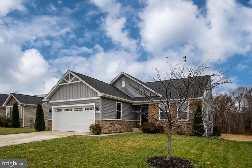 This beautiful home is less than five years young and move-in ready! Designed for easy main-level living, it combines modern comfort with  scenic surroundings.

Step inside to an inviting open-concept layout where the great room flows seamlessly into the kitchen and dining area. Through the sliding glass doors, you’ll be treated to a stunning backdrop of open meadow and  trees—your own slice of serenity.

The gourmet kitchen features granite countertops, stainless steel appliances, and a large island with plenty of seating—perfect for casual meals or gathering with friends. The light-filled primary suite offers a spacious walk-in closet and a beautifully appointed bath, all framed by tranquil views of the trees. Two additional bedrooms on the main level share a full hall bath and provide flexibility for family, guests, or a home office, each with large windows that fill the home with natural light.

Engineered hardwoods run throughout the main living areas for a clean, modern look and easy maintenance. The convenient main-level laundry room adds to the home’s thoughtful design and everyday functionality. Step out from the dining area to a covered porch and a rear patio—ideal spaces to enjoy your morning coffee or evening sunsets. The full basement, with a large egress window and rough in bath, offers endless possibilities for finishing exactly to your liking.

Hopyard Farm residents enjoy an exceptional lifestyle with resort-style amenities, including a boat dock on the Rappahannock River, walking trails, a clubhouse with party space, a large outdoor pool, basketball courts, and playgrounds.

Perfectly located between Fredericksburg and Dahlgren, this home offers the best of both worlds—peaceful living with easy access to major commuter routes, shopping, and dining.

Come see why 11260 Emerald Drive is the perfect place to call home!