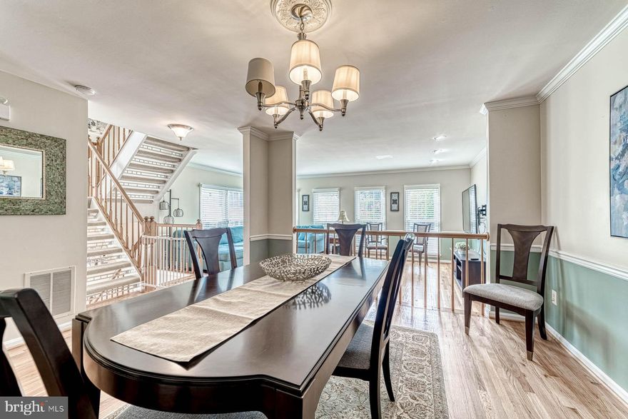 Location +  Space + Quality = AWESOME  This 4Br/3.5BA all brick end unit townhouse on the.best.lot in popular Daventry Park backs to wooded common area.  Convenient to everything - off Rolling Road near the FFX County Parkway just minutes from I-95/395, Metro and VRE.  Hardwoods throughout the light-filled main floor -  freshly painted eat-in-kitchen has 5 year old high-end LG stainless appliances and granite counter tops. Spacious MBR with vaulted ceilings, WIC and 4 piece BA.  All second floor BR have vaulted ceilings. Basement has Rec Room with gas fireplace. Laundry area is in a side hall (W/D do not convey) leading to a full BA.  The recently updated office/BR has  LVP flooring.  Replacement windows have a lifetime warranty.  Large back deck off kitchen and LL patio off the rec room are both great for entertaining.  Small side yard is perfect for a garden area.  There is a one car garage plus a reserved parking space.  This cozy neighborhood of spacious town homes features a tot lot and walking paths.  Who could ask for anything more?!  Offer deadline is Monday at 5PM.