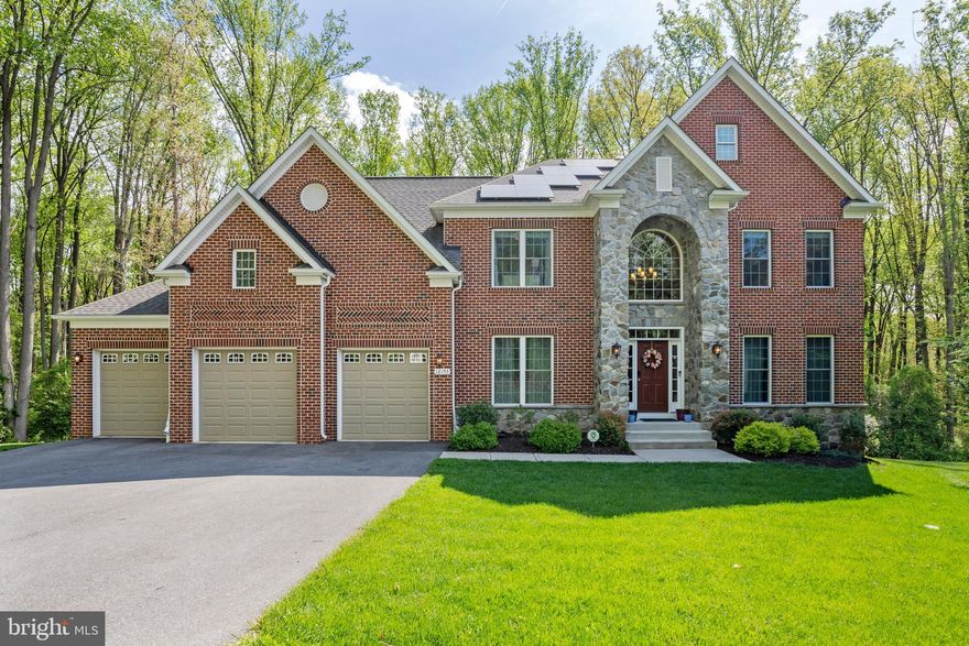 Welcome home to this stunning brick-front residence nestled in the serene community of Fulton Manor Valley. Instantly captivating with its picturesque curb appeal, this meticulously maintained home boasts a timeless blend of brick and stone façade complemented by lush, well-manicured landscaping. Built in 2020, this elegant abode offers five bedrooms, four and a half bathrooms, a versatile den/home office on the main level, and a finished basement, providing ample space for comfortable living and entertaining.
Upon entry, you're greeted by an airy and luminous main level, adorned with gleaming, recently refinished hardwood floors and anchored by a cozy gas fireplace in the family room. The gourmet kitchen is a chef's delight, featuring a spacious center island with seating, a five-burner stove, double oven, generous countertop space, storage, and a convenient pantry. Adjacent to the kitchen, the sunroom beckons with its sun-drenched ambiance, serving as an ideal spot for casual dining or relaxation while offering seamless access to the expansive deck, where you can savor private wooded views and outdoor gatherings.
Ascend the dual staircases to discover the generously proportioned primary suite, boasting two walk-in closets and a spa-like bath complete with a double vanity, separate shower, and indulgent soaking tub. Four additional well-appointed bedrooms, two bathrooms, and a convenient laundry room complete the upper level.
The finished walk-out basement has great natural light and offers a spacious family/recreation room and a full bath, along with abundant storage space in the sizable closet and unfinished area. The property also features a three-car garage, providing additional storage and convenience.
Noteworthy amenities include dual-zone heating and cooling, as well as the paid-off solar panels that convey with the property, offering energy efficiency without the burden of a lease or lien. Situated on a private 1.32-acre lot with tranquil wooded surroundings, this home also includes a charming playset for outdoor enjoyment.
Conveniently located near all that Fulton and Maple Lawn have to offer, including dining, shopping, groceries, pharmacy, and more. Easy access to Route 29 ensures a stress-free commute to nearby destinations, Baltimore, or DC. Back on the market with a new price! Buyers financing fell through! This home is fully available and ready for you to move right in.