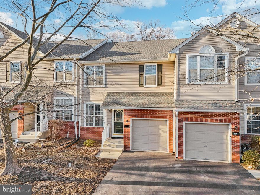 Welcome to 417 Nottingham lane, a stunning townhome in a prime location! Nestled in the highly sought-after Providence View community, this beautiful 3-bedroom, 2.5-bathroom townhouse offers the perfect blend of comfort, style, and convenience. With a spacious open-concept floor plan, a 1-car garage, and abundant natural light throughout, this home is designed for modern living and effortless entertaining. Step inside to find gleaming hardwood floors that flow seamlessly throughout the first floor. The front entry is spacious and opens to the dining room adorned with beautiful trim. The open layout ensures a natural flow from one room to the next, making the home feel both expansive and connected. The kitchen is a chef’s delight, remodeled in 2022, offering a wealth of cabinet storage, quartz counters, and gas cooking with outside venting. The breakfast bar overlooks the living room, allowing for easy conversation while preparing meals. Adjacent to the kitchen, the sunroom boasts large windows that fill the area with warm, natural light. Sliding glass doors lead to the private deck—ideal for al fresco dining or simply relaxing with your morning coffee. The main floor also includes a convenient half bathroom, a hall closet, and direct access to the garage. Ascend the hardwood staircase to discover a serene owners suite, where luxury and tranquility await. The owners suite features a dramatic vaulted ceiling, a spacious walk-in closet, and a spa-like master bathroom. Recently remodeled in 2023 with new flooring, this bathroom is equipped with a double vanity, an oversized glass-enclosed shower—providing a perfect space to unwind. Two additional generously sized bedrooms share a full hall bathroom, recently updated with a tub-shower combo, offering plenty of space and comfort for family or guests. The laundry area is conveniently located on this level, ensuring everyday chores are a breeze. The finished basement expands your living space with a large versatile area that can serve as a media room, playroom, home gym, or office—the possibilities are endless! A large storage room and under stairs storage provide practical space to keep your home organized and clutter-free. Providence View offers fantastic amenities, including a community pool and a well-equipped gym, giving you access to a resort-style lifestyle right at home. HVAC new in 2022, roof and water heater new in 2020. The location is unbeatable—situated close to major routes for an easy commute and just minutes from the popular Providence Town Center, where you'll find shopping, dining, and entertainment options galore. Don't miss the opportunity to make this incredible townhome your own. Schedule your showing today and experience all that 417 Nottingham has to offer!