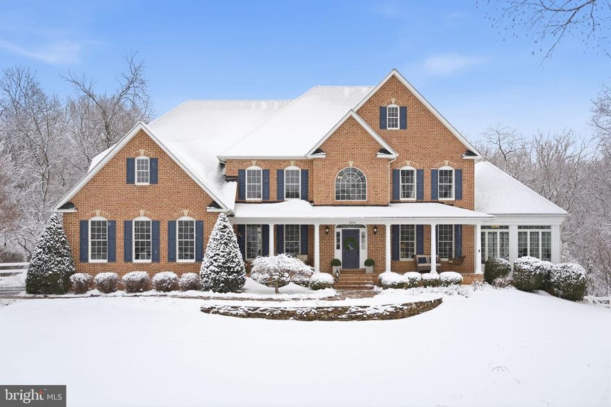 Nestled within the prestigious enclave of Little Caledonia, this exquisite Wilson Home built residence embodies the pinnacle of luxury living. Spanning nearly four acres, this traditional Colonial masterpiece is a harmonious blend of elegance and comfort, offering a resort-like lifestyle, fit for a homeowner's dream. As you approach the property, the stately brick façade exudes timeless charm, complemented by cherry blossomed tree lined drive & professional meticulously landscaped grounds that create a serene atmosphere. Step inside to discover an interior that radiates sophistication, luxury, & warmth. The 18-foot high grand foyer welcomes you home with rich hardwood flooring, accentuated by crown moldings and a stunning open chandelier . The open floor plan seamlessly connects the formal dining room and living areas, perfect for entertaining or intimate gatherings. A cozy wood-burning fireplace, framed by elegant mantels, serves as a focal point in the living space, inviting warmth and comfort. The family room additionally offers a custom built-in perfect for entertainment equipment, private storage & special decor items for display. The gourmet kitchen is a culinary enthusiast's dream, featuring stainless steel appliances, a spacious island, granite countertops and an abundance of cabinetry, including a pantry for all your storage needs.  The adjoining breakfast area offers picturesque views of the lush rear yard, while the family room off the kitchen ensures that everyone can gather in style. The conservatory room adds an exceptional addition to the home, boasting captivating views of the outdoors ensuring this room is a delight to relax in during all 4 seasons of the year. 
Retreat to the second level to the luxurious primary suite, where tranquility reigns. This sanctuary boasts vaulted ceilings, a walk-in closet, and a private sitting area. Attached to the suite is a completely renovated spa-like bathroom complete with a soaking tub, a walk-in shower with sitting area, and heated marble floors providing a perfect escape after a long day. The additional 3 bedrooms on this level include spacious layouts, bathroom access & generous closet space, making any of these rooms a delight to live in.

The outdoor oasis is equally impressive, enhancing the resort living style of the home. Featuring a fully updated personal in-ground, gunite pool that is self-cleaning & heated, allowing you to fully enjoy without the hassle of daily maintenance & concerns of cool temperatures. The pool is accompanied by a spacious deck (built 2024), New poolside patio & walkways composed of flagstone & local natural stone, ideal for sun-soaked afternoons and evening gatherings. The property backs to trees, offering a sense of privacy and a scenic vista that enhances the natural beauty of the surroundings. Additional highlights include 3 car garage, private bonus room, back staircase for convenient kitchen access, a basement with a walkout level, providing endless possibilities for customization, and a spacious main-floor laundry for convenience.   
With its stunning views, breathtaking landscape and lush greenery, this residence is not just a home; it's a lifestyle. Experience the perfect blend of luxury, comfort, and nature in this exceptional property, where every detail has been thoughtfully curated for the ultimate living experience.