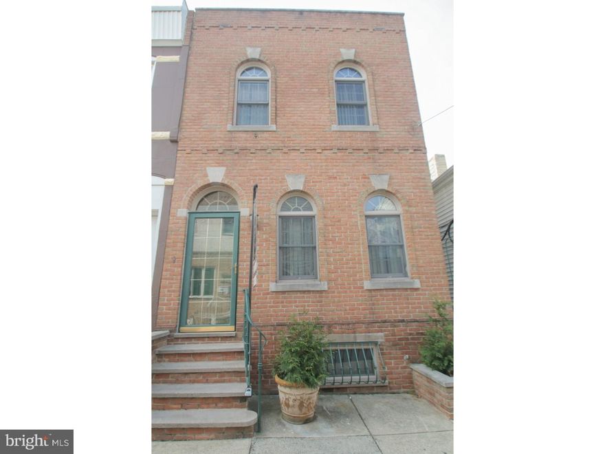 The gorgeous architectural details of this classic south Philly home beckon you in!  The tall arched windows - mirrored in the transom above the brand new front door - flood the first floor with warm sunlight. The newer floors lead you through the open concept living space to the semi-formal dining area and vintage inspired kitchen, into your private outdoor oasis. Upstairs you'll find three spacious bedrooms, each with their own temperature controlling ceiling fan. The shared hall bath features a roomy standing shower with custom tile surround. The finished basement includes brand new flooring and plenty of space for a play room, entertainment space, or man cave, with room left over for a dedicated laundry area. This beautiful home features gas heat and hot water, a garbage disposal, walking to dining, shopping and worship, and just steps from the gorgeous Guerin Recreation Center and their expansive playground.