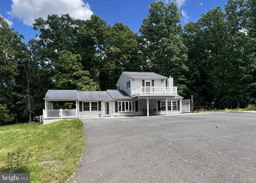 Wow what a great home! 1037 Ravens Rocks rd is a 3/1 bi-level home with 1464 sq ft of living space in the main home. There is also a  detached garage/workshop featuring additional  living space w/ large living area, kitchen, bedroom and 1/2 bath. Additionally this wonderful  home is at the very end of the road in a cul-de-sac for privacy  on 6 level wooded acres. There is a gate leading to a fully paved driveway that brings you right to the door step of this amazing property for extra security and protection as well. This home is also located very close to public access points for the Potomac river in beautiful Springfield WV in the heart of Hampshire Co WV for added recreational opportunities as well.  This home would be great as either a full time home or second home in Wild, Wonderful, WV so come to the Potomac Highlands where Mountaineers are always free own a your slice of " Almost Heaven"